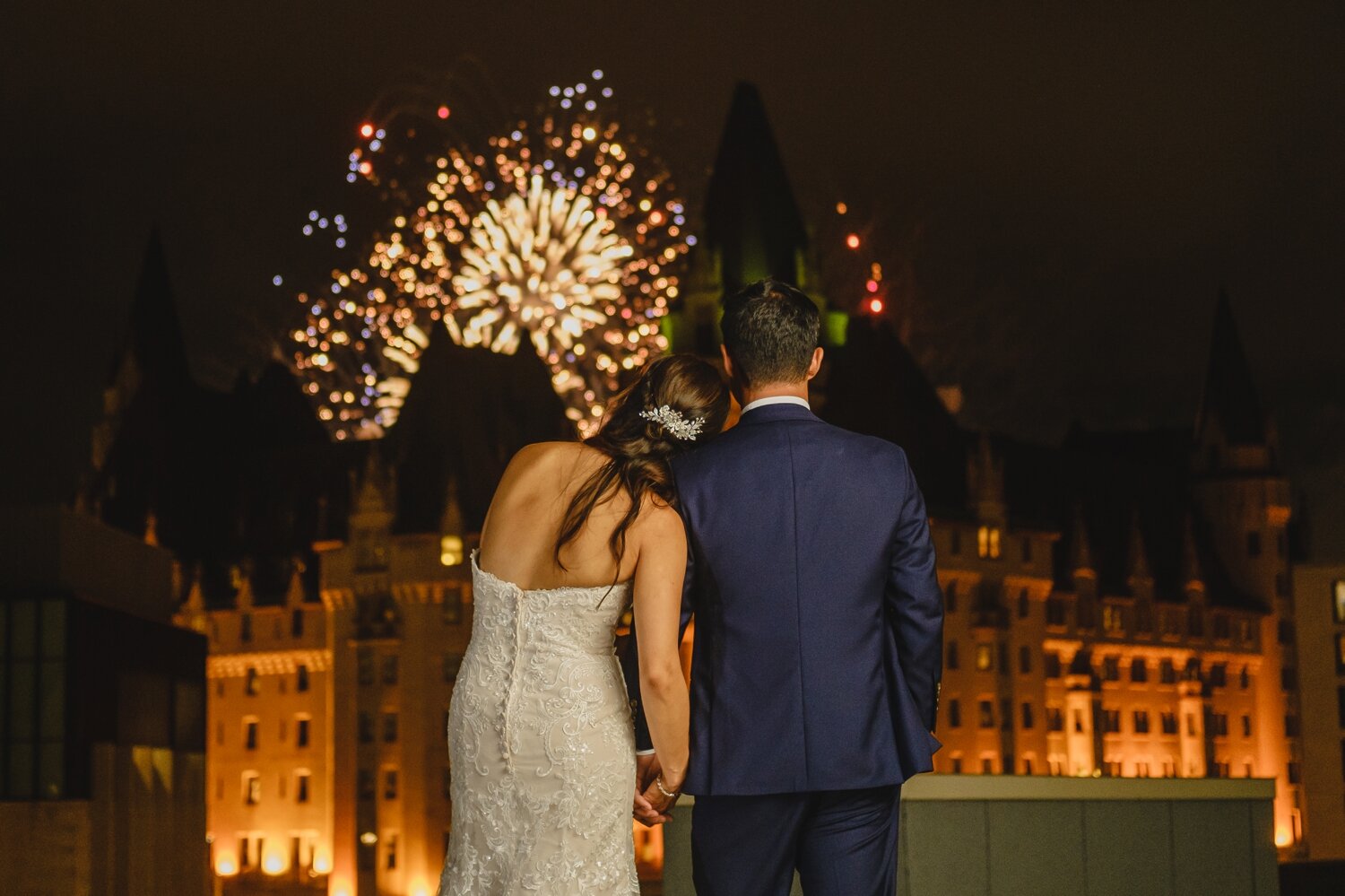 photo of bride and groom with fireworks during a venue twenty two wedding at the westin ottawa ontario