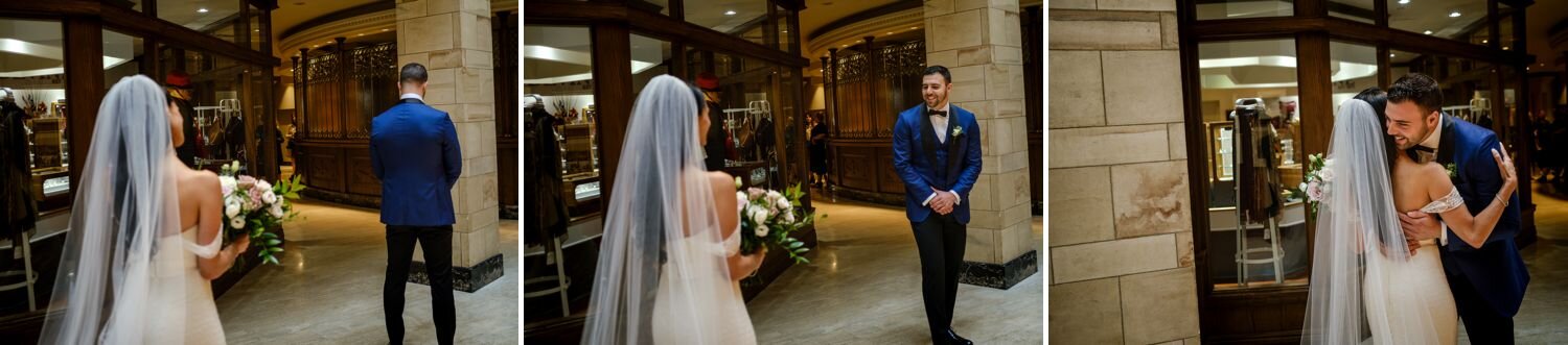 bride and groom have their first look before a wedding ceremony in the canadian room at the fairmont chateau laurier