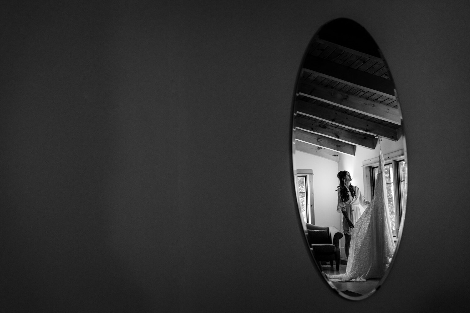 black and white photo of a bride getting ready at le belvedere