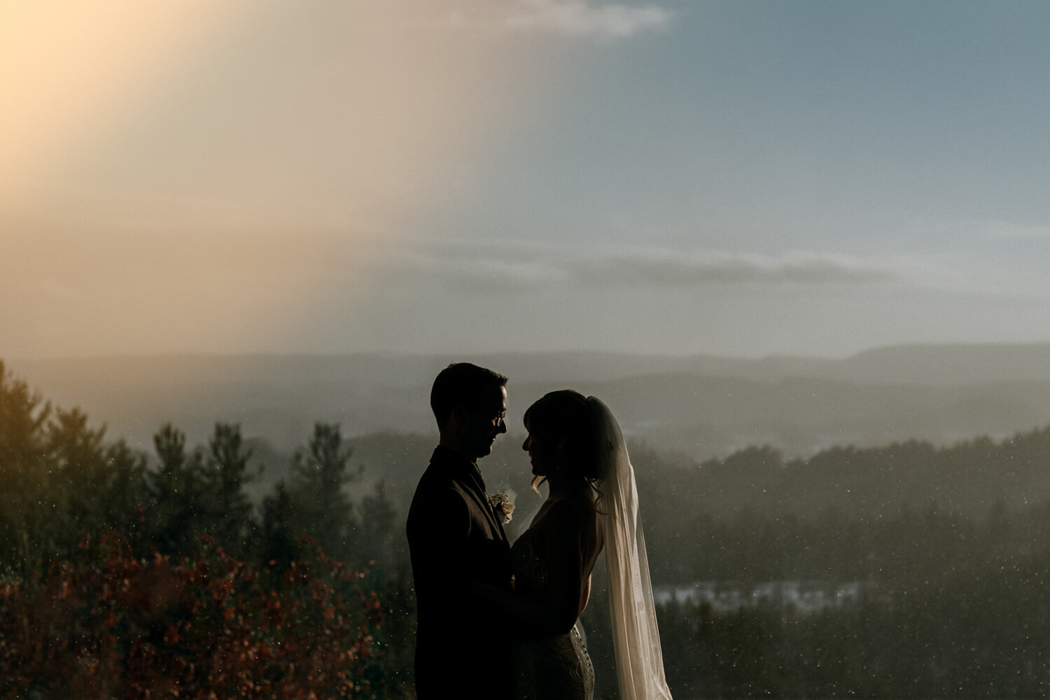 dramatic photo of a bride and groom overlooking the valley at le belvedere