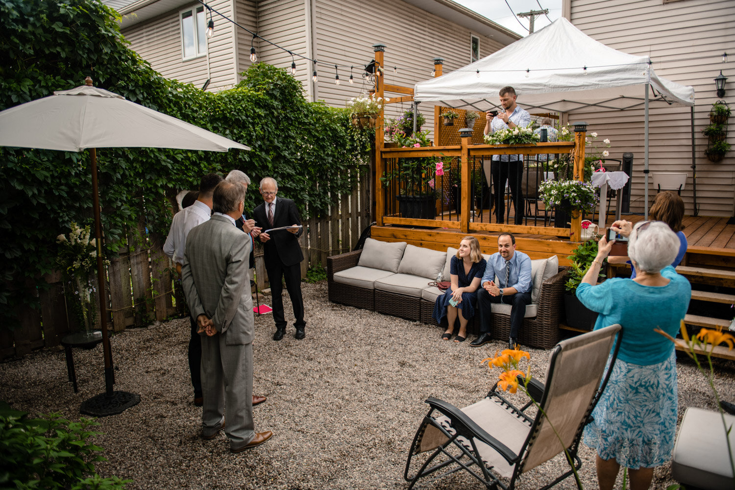 wide angle photo of a backyard wedding ceremony in ottawa