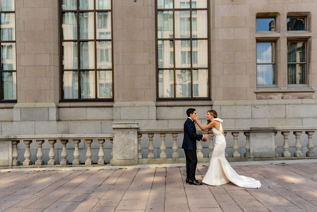 bride and groom sharing a first look outside Ottawa's Fairmont Chateau Laurier