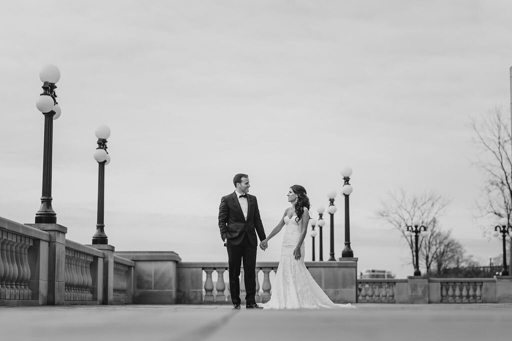 bride and groom holding hands on Chateau Laurier terrace