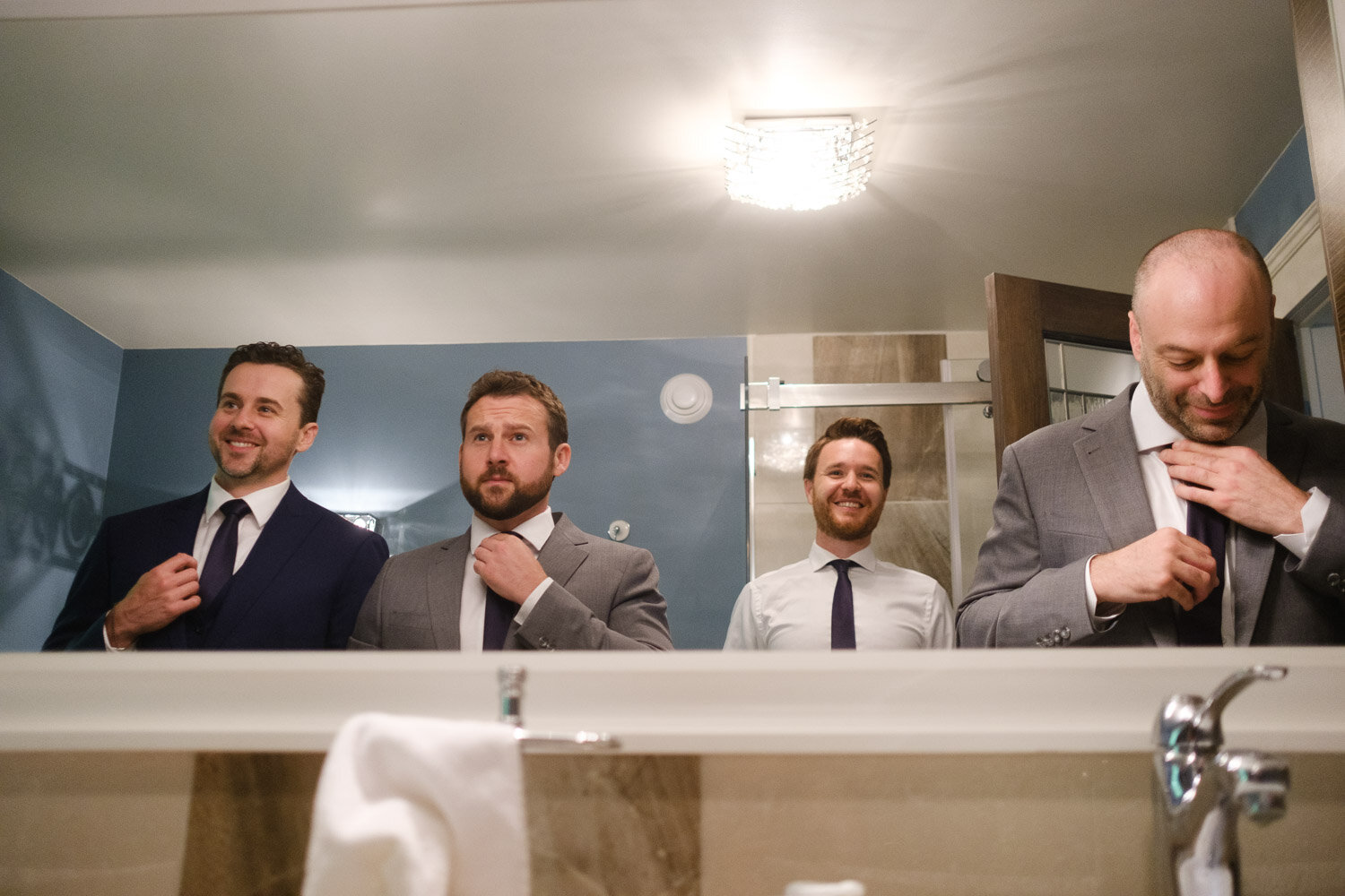 groom and groomsmen getting ready for a wedding