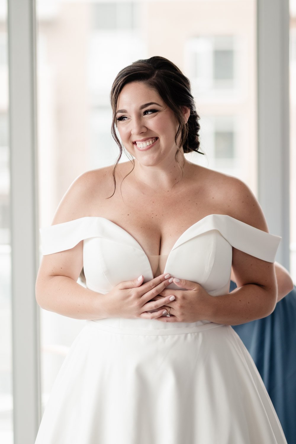 photo of an ottawa bride getting her dress on