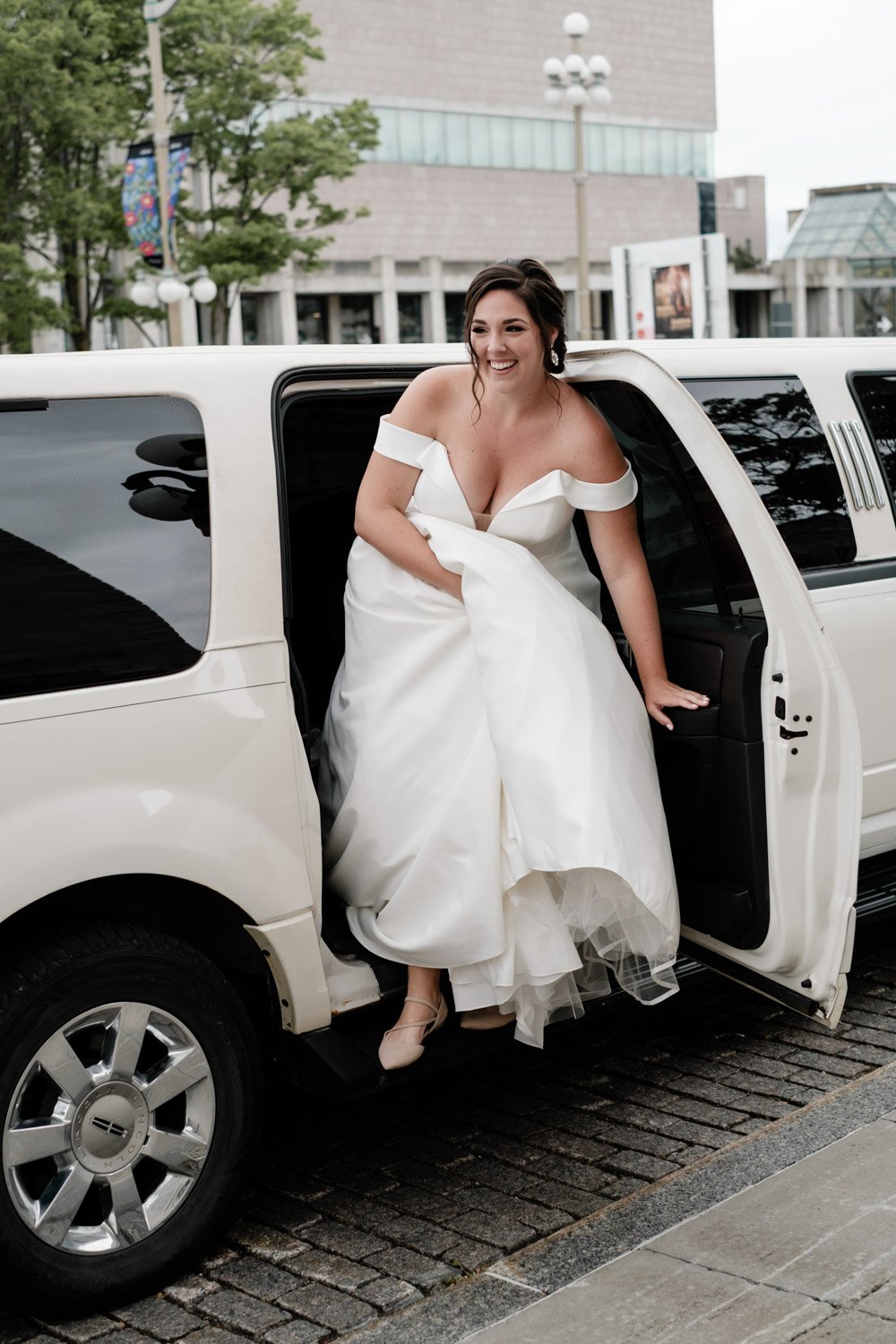 bride getting out of a limo