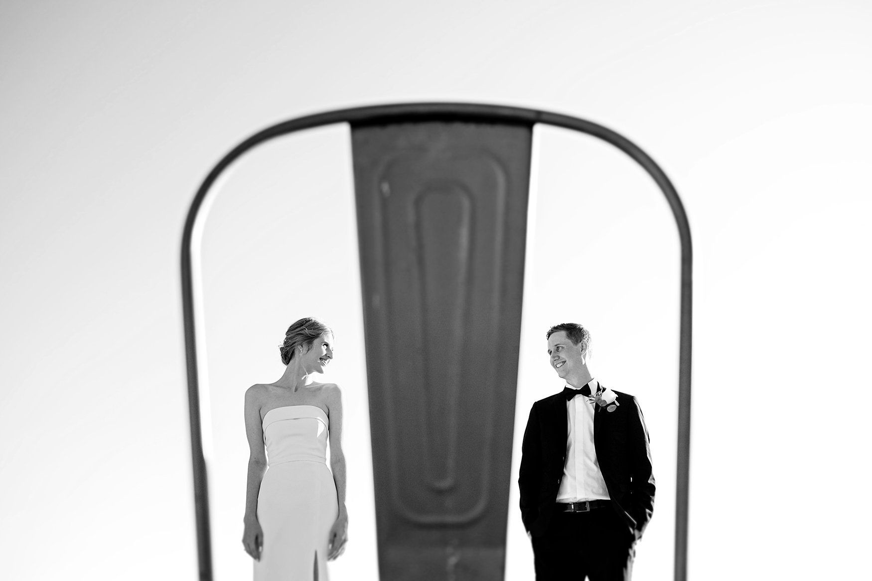 Photo of a bride and groom framed by a chair at le belvedere in wakefield quebec (Copy)