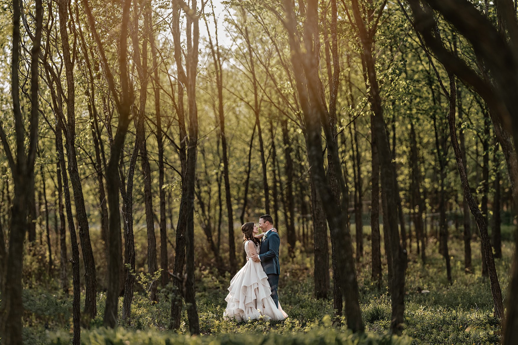 bride and groom pose for a photo in the forest at stonefields estate in ottawa ontario (Copy)