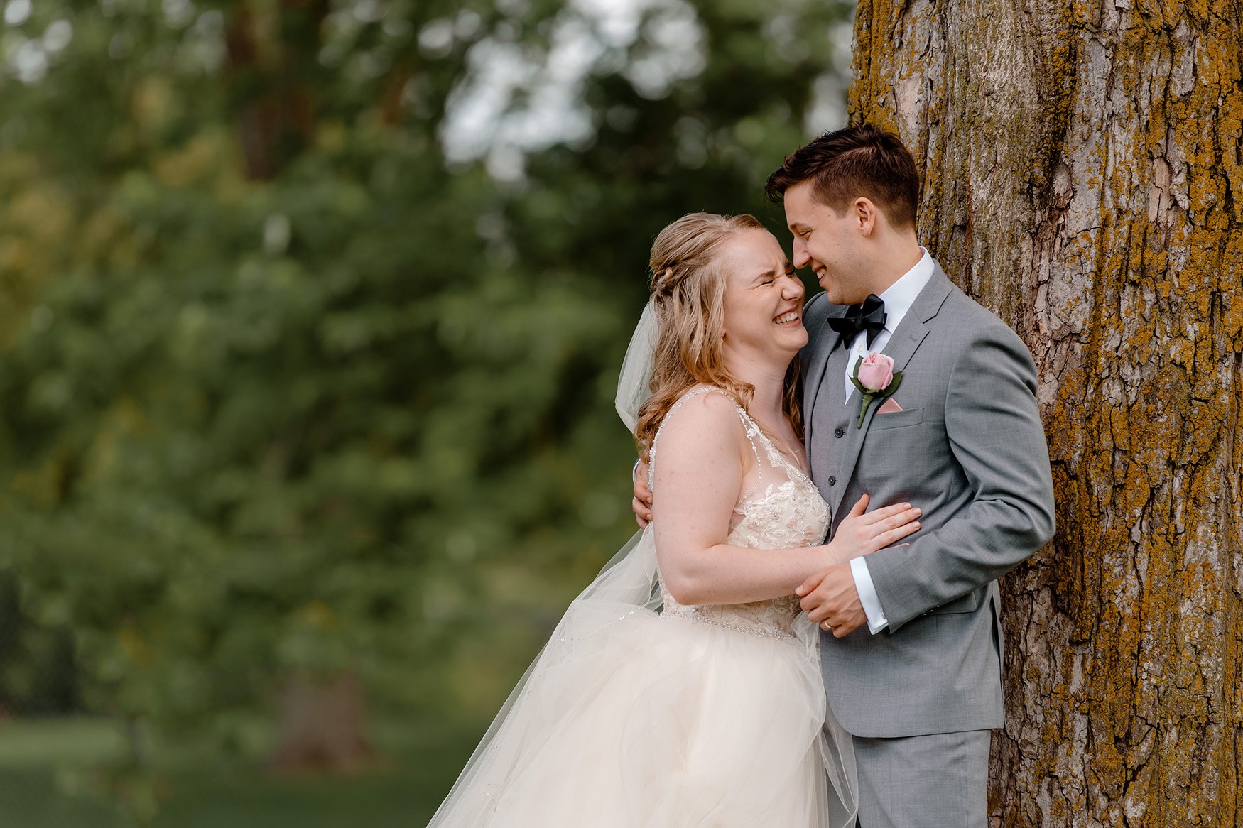 bride and groom have a moment during a wedding portrait shoot in ottawa ontario 