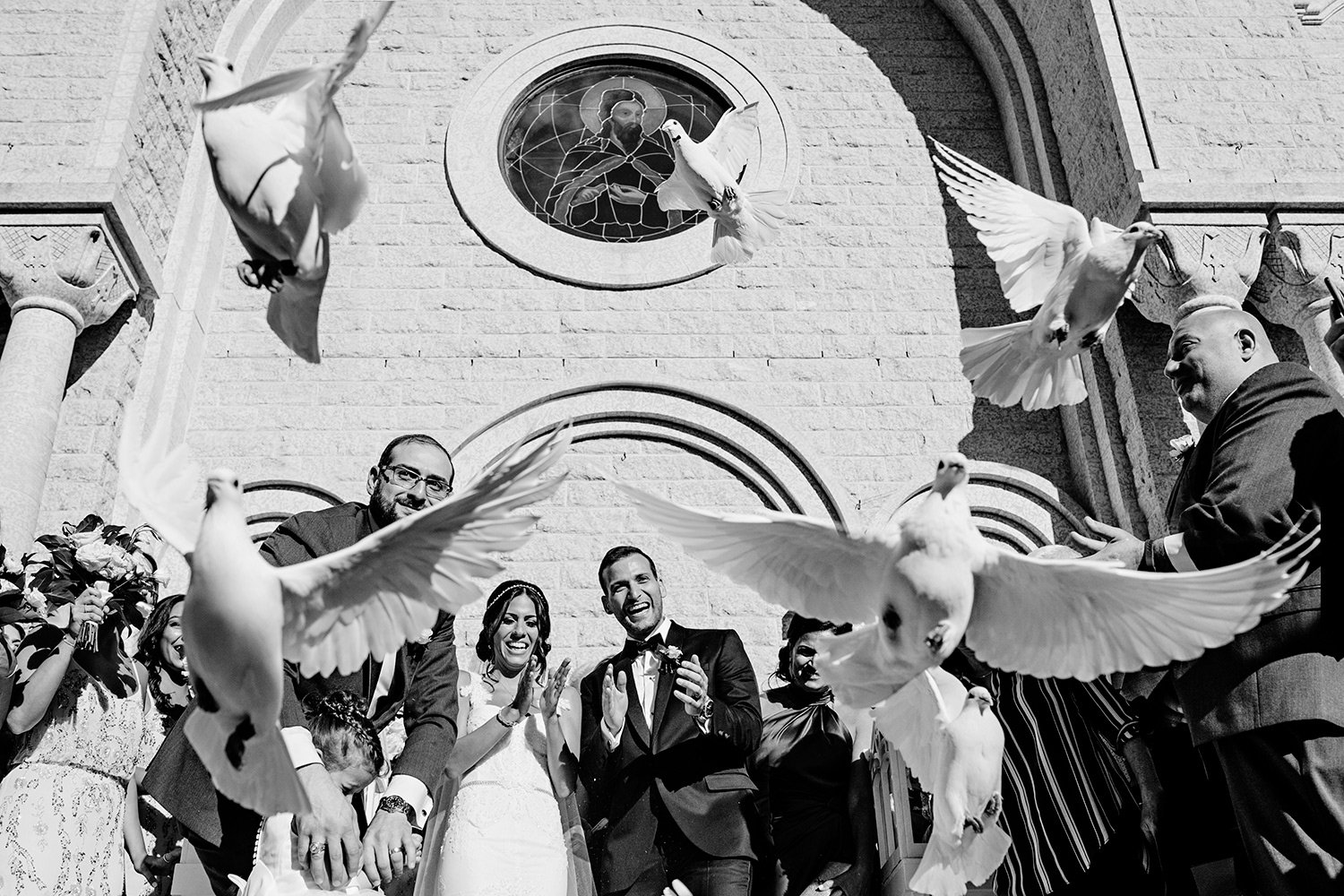bride and groom release doves at the st elias church during a lebanese wedding in ottawa (Copy)