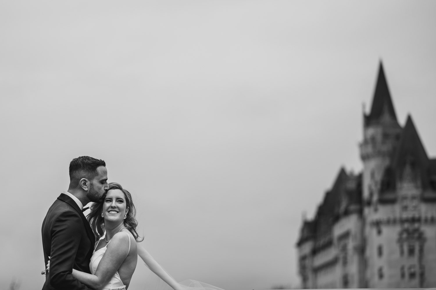 black and white photograph of a bride and groom on the terrace at the NAC in Ottawa
