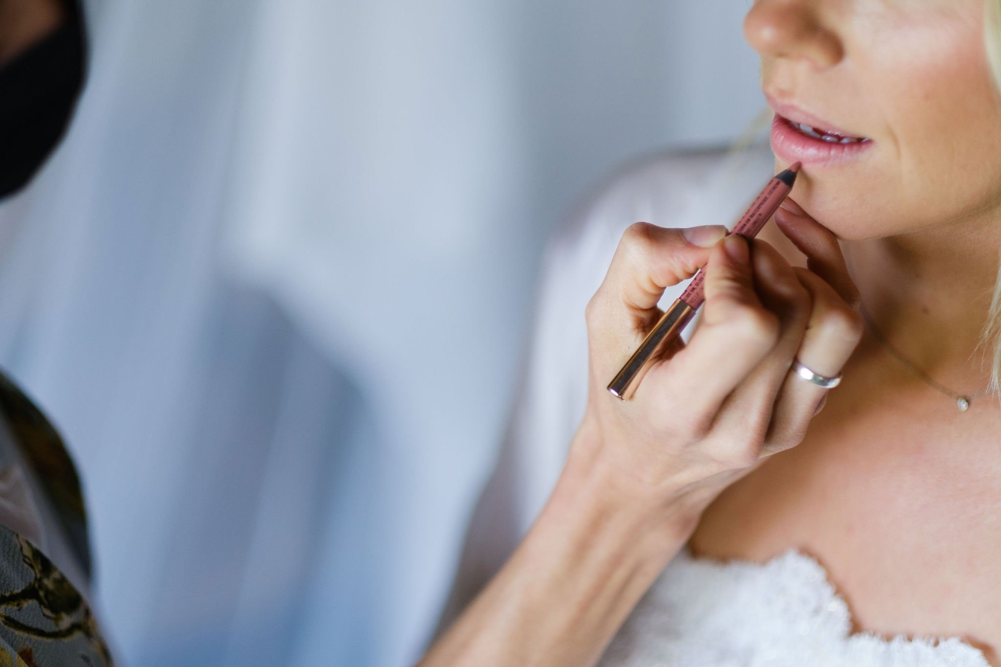 photo of a bride getting her makeup done