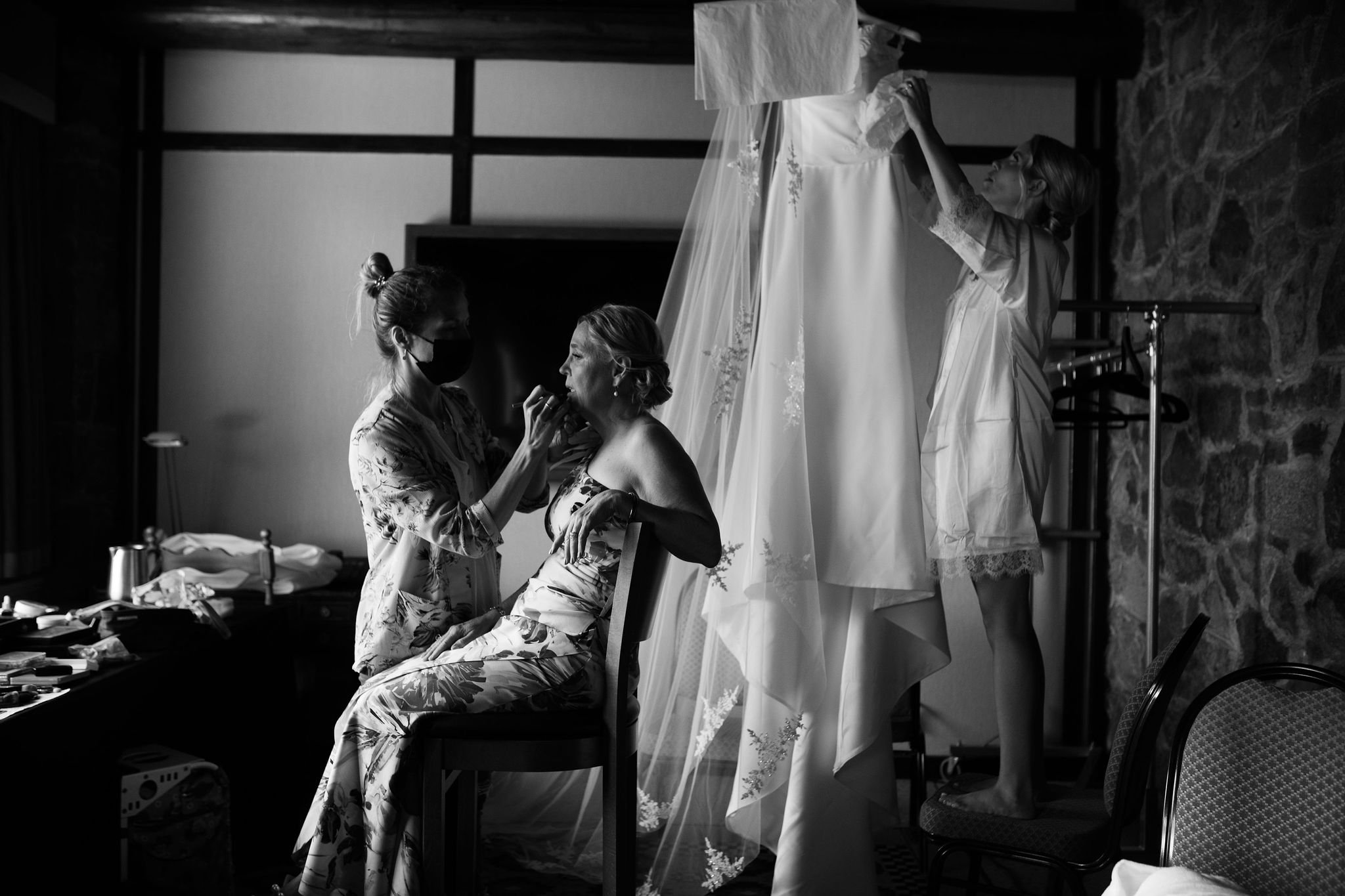 black and white photo of a bride getting ready