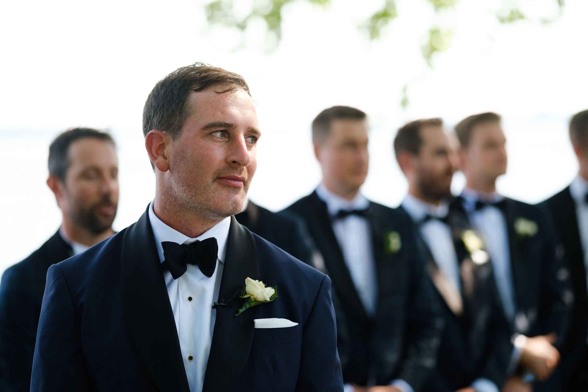 a groom sees his bride walking down the aisle