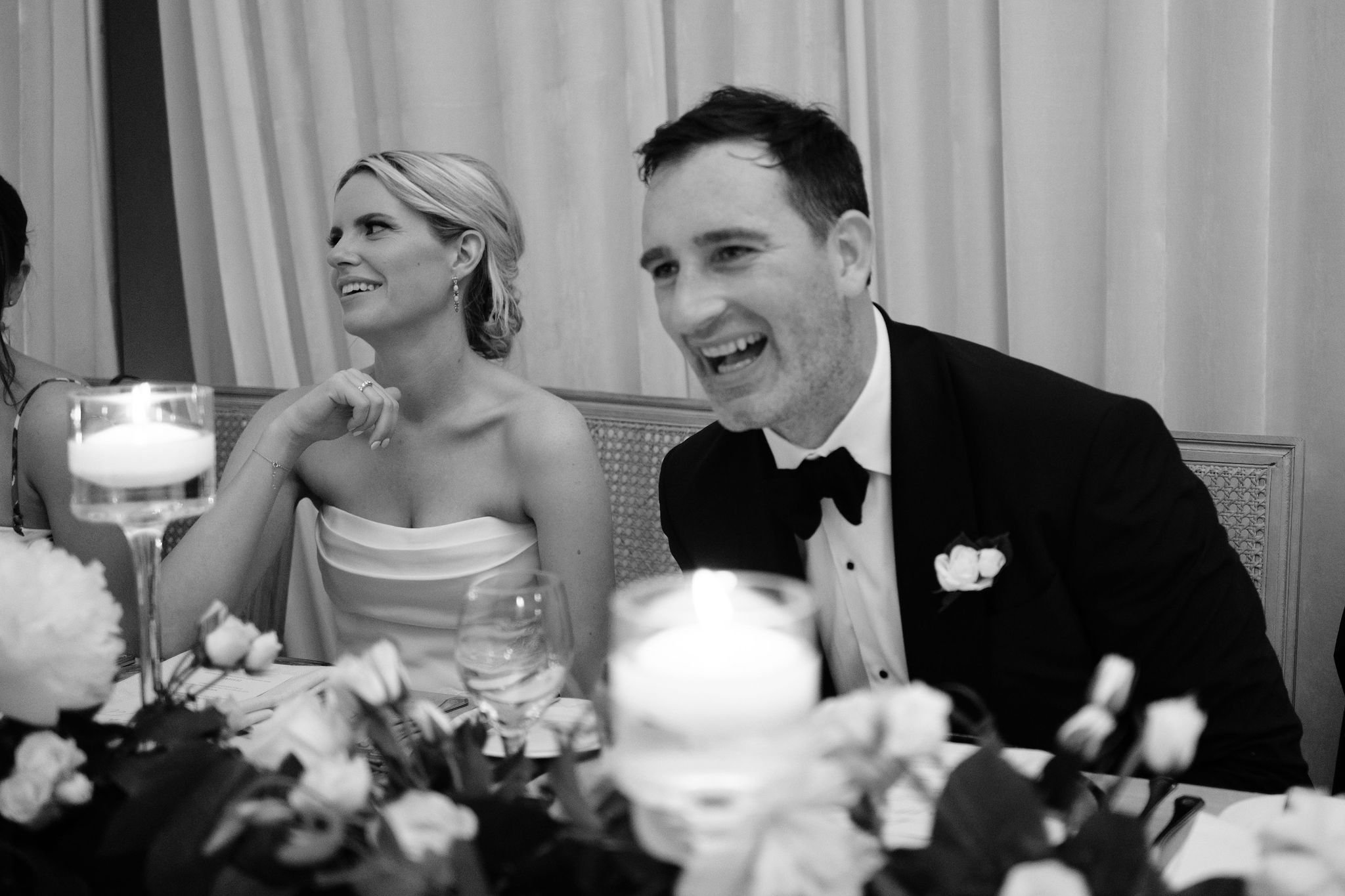 bride and groom reacting to a speech