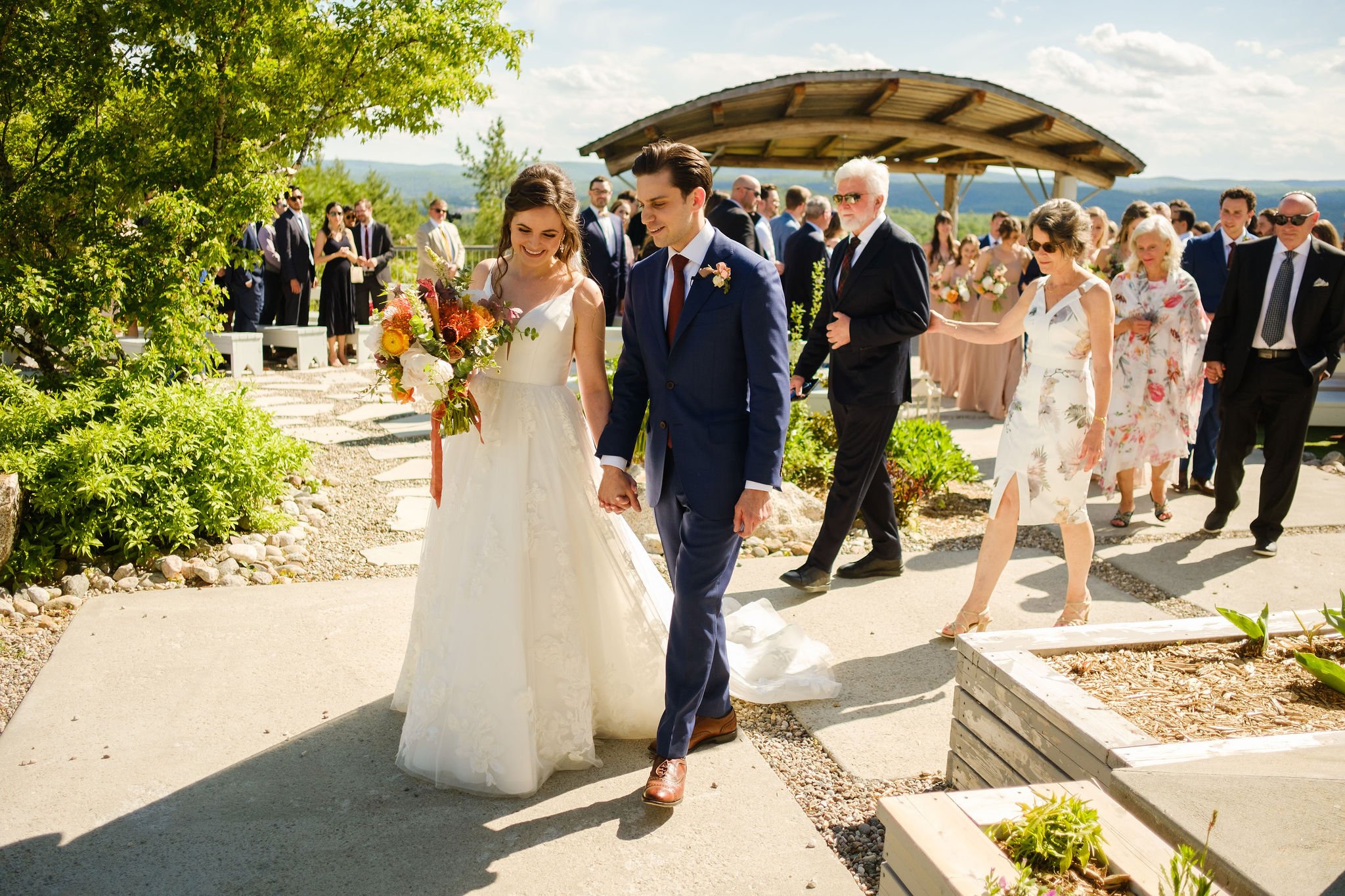  couple walk back down the aisle after there wedding ceremony 