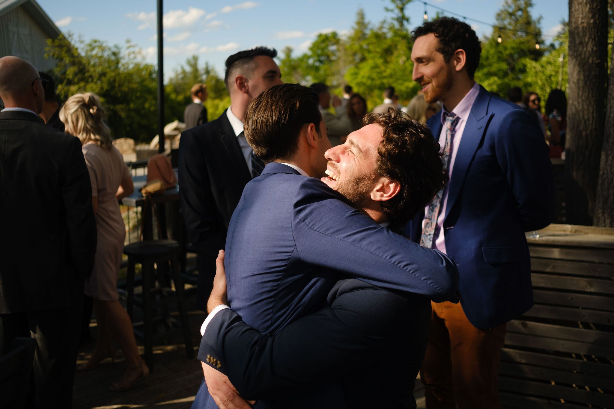  grooms friends give him a hug  