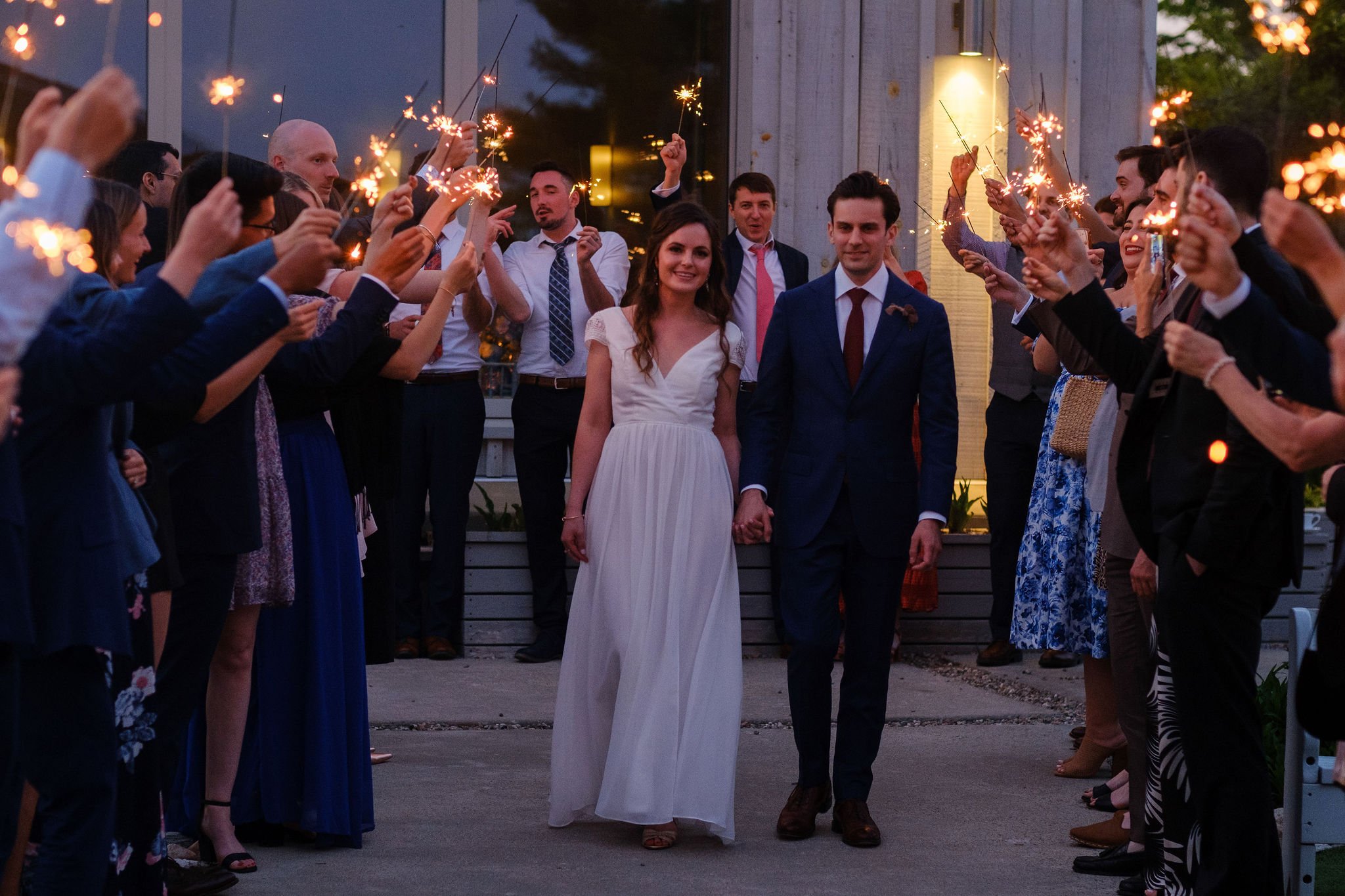  bride and groom walking to their outdoor first dance at le belvedere 