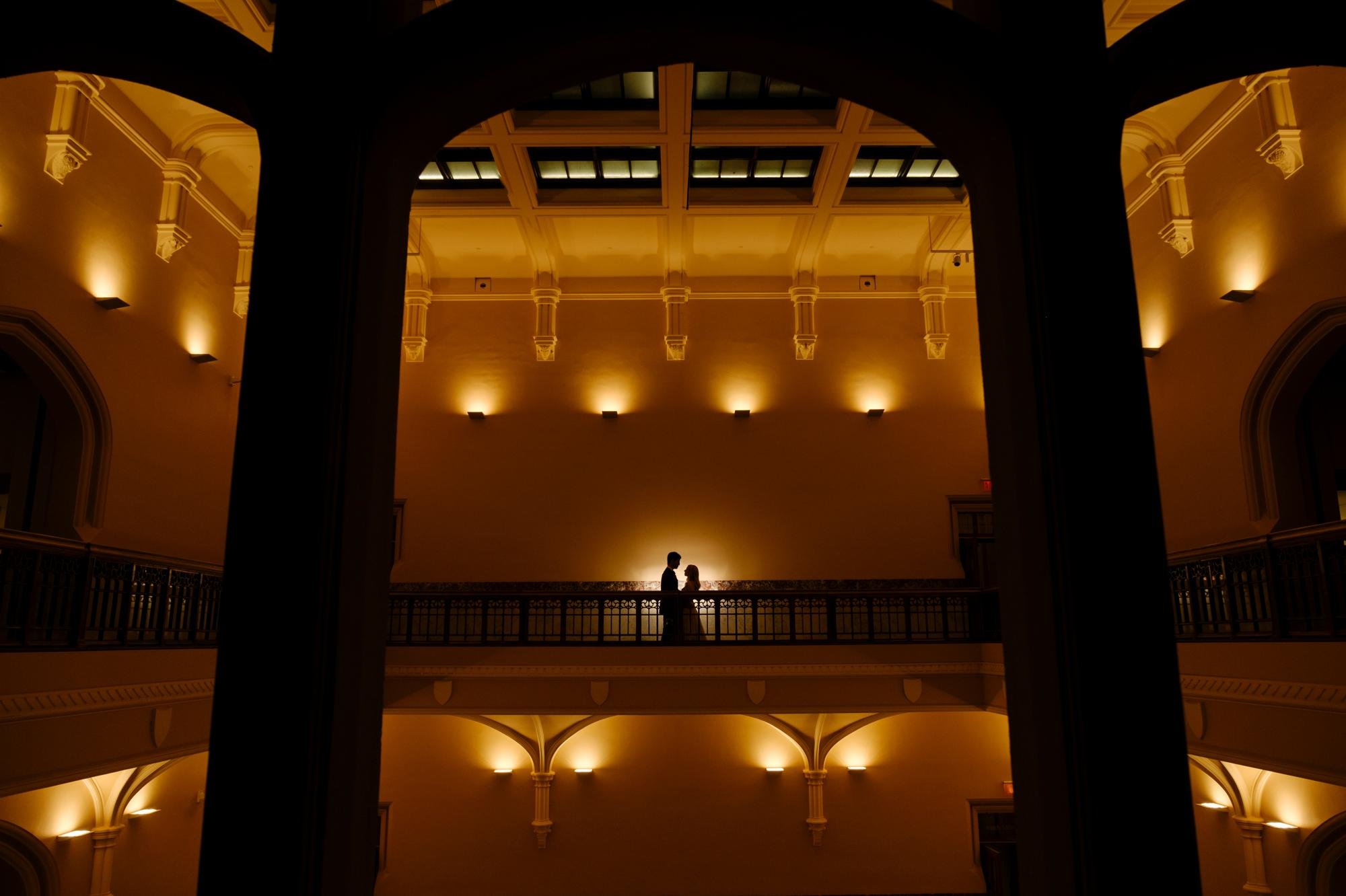 a nighttime photograph of a bride and groom at the museum of nature in ottawa