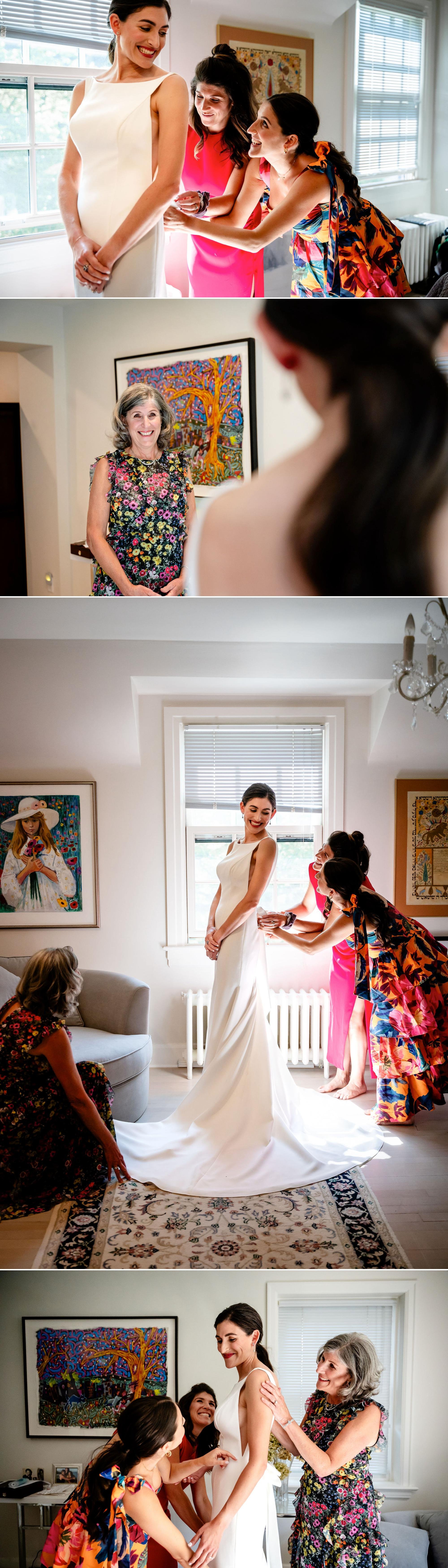 photograph of a bride getting in to her wedding dress