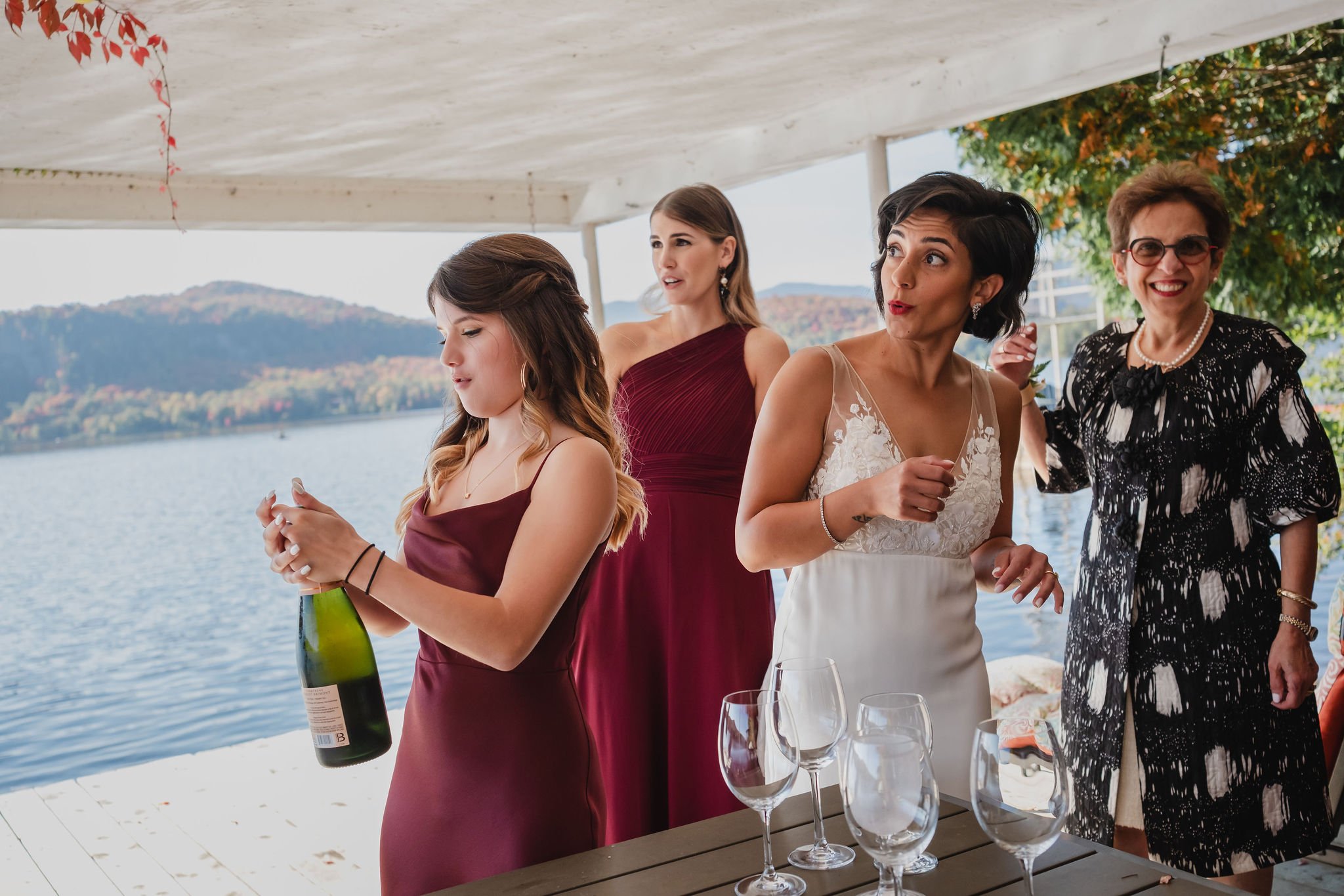 bride and her bridesmaids drinking champagne before her wedding ceremony
