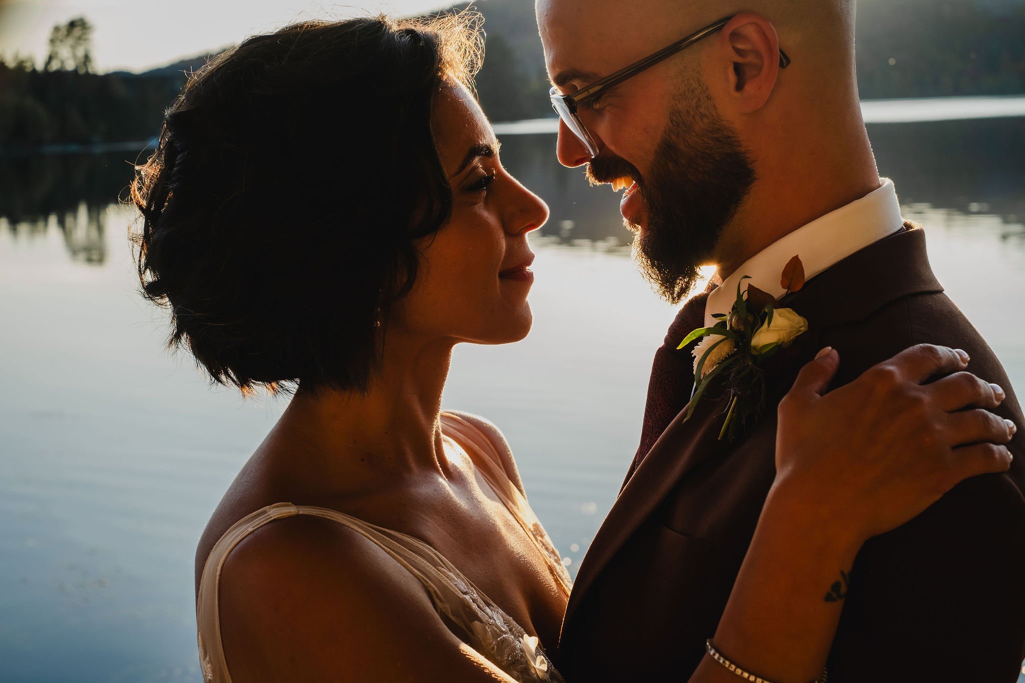 wedding photograph at sunset by a lake in mont Tremblant