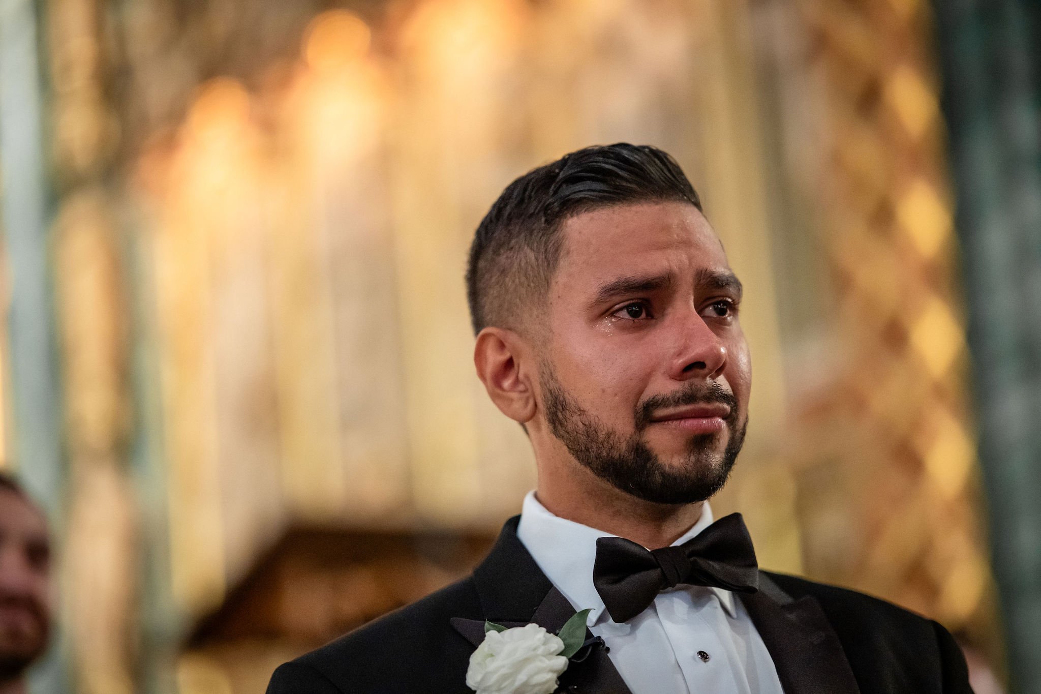 groom crying seeing his bride for the first time