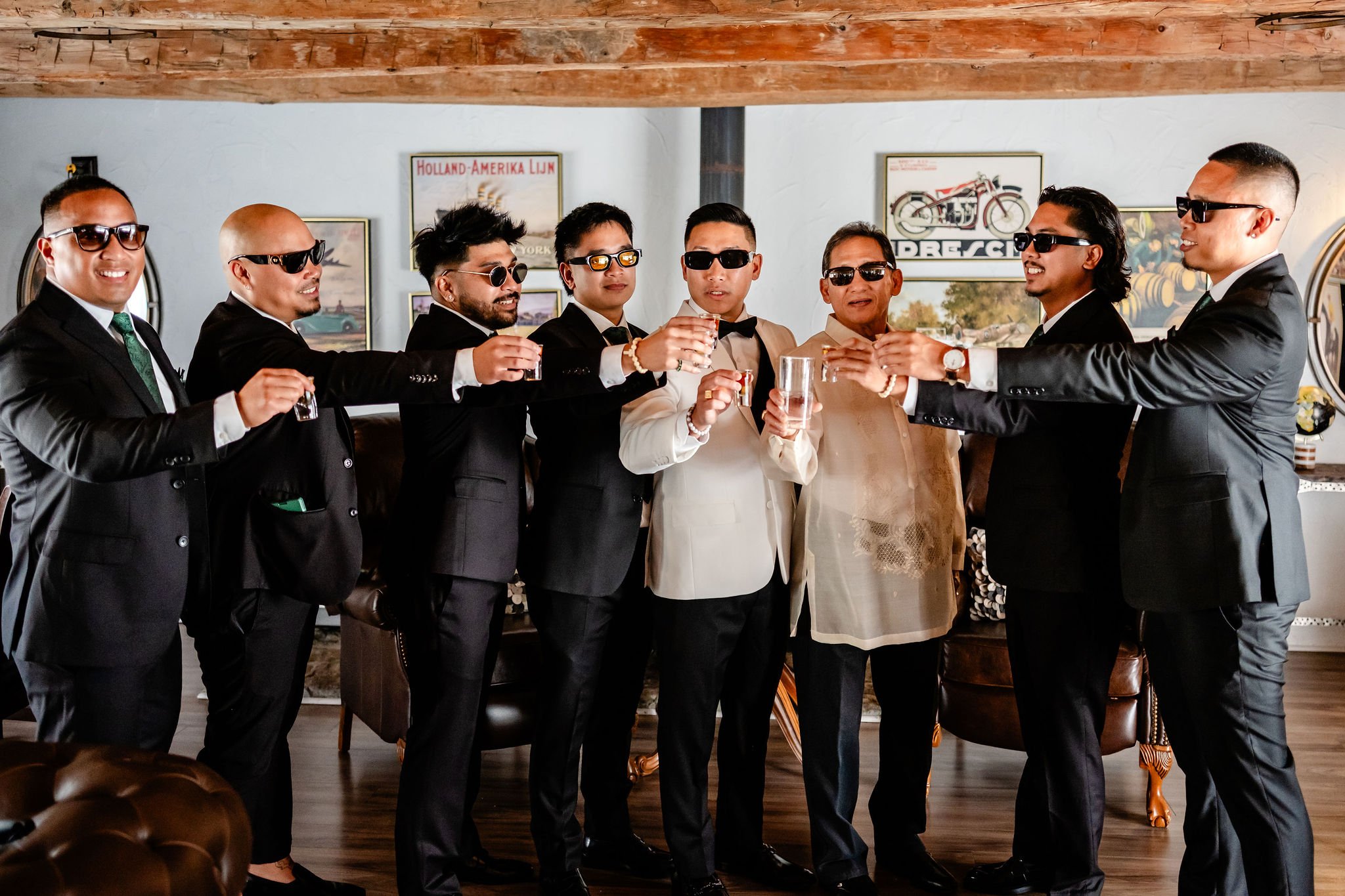 groomsmen having a drink before a wedding