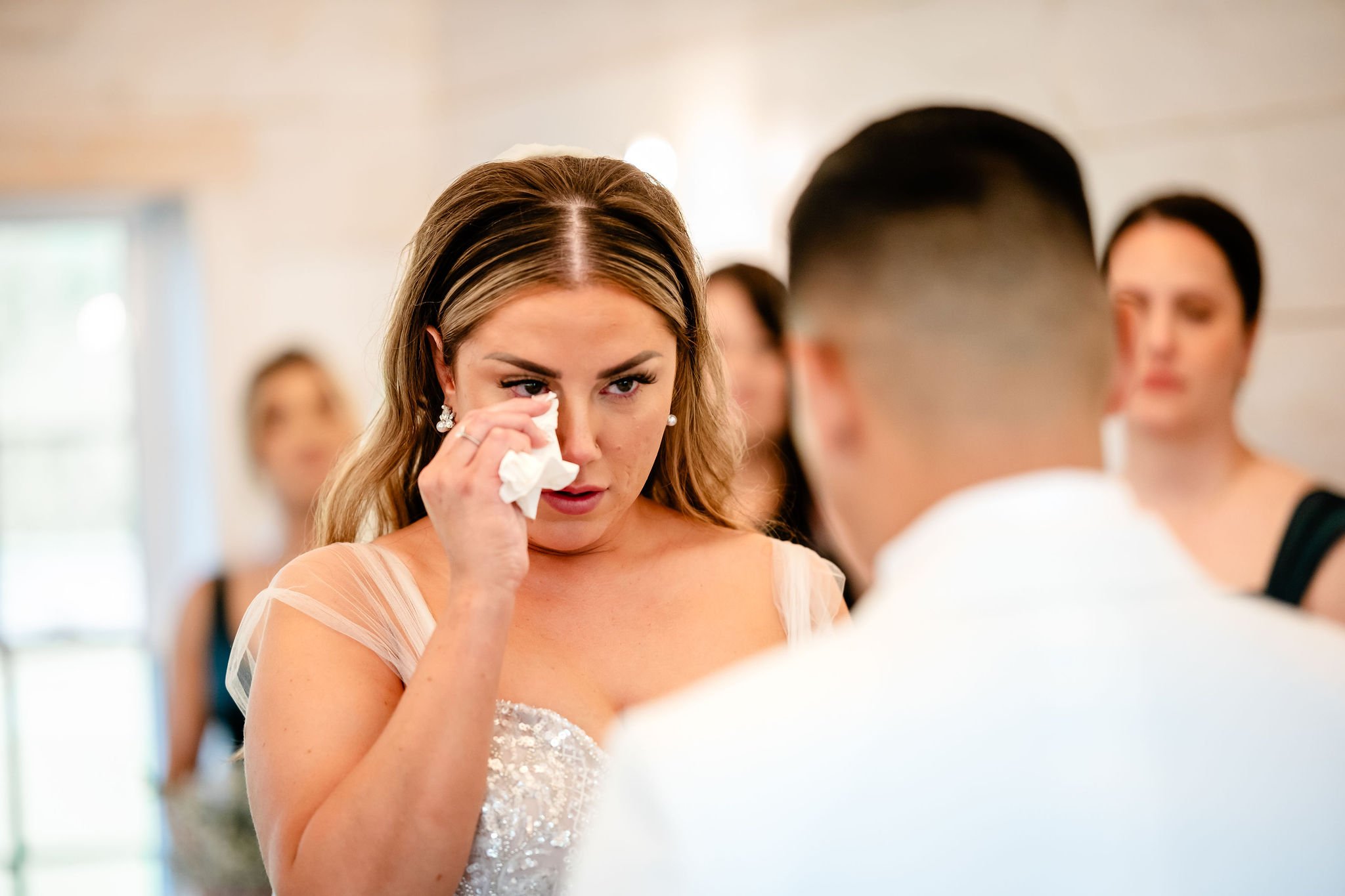 candid wedding ceremony photograph at an indoor stonefields estate wedding