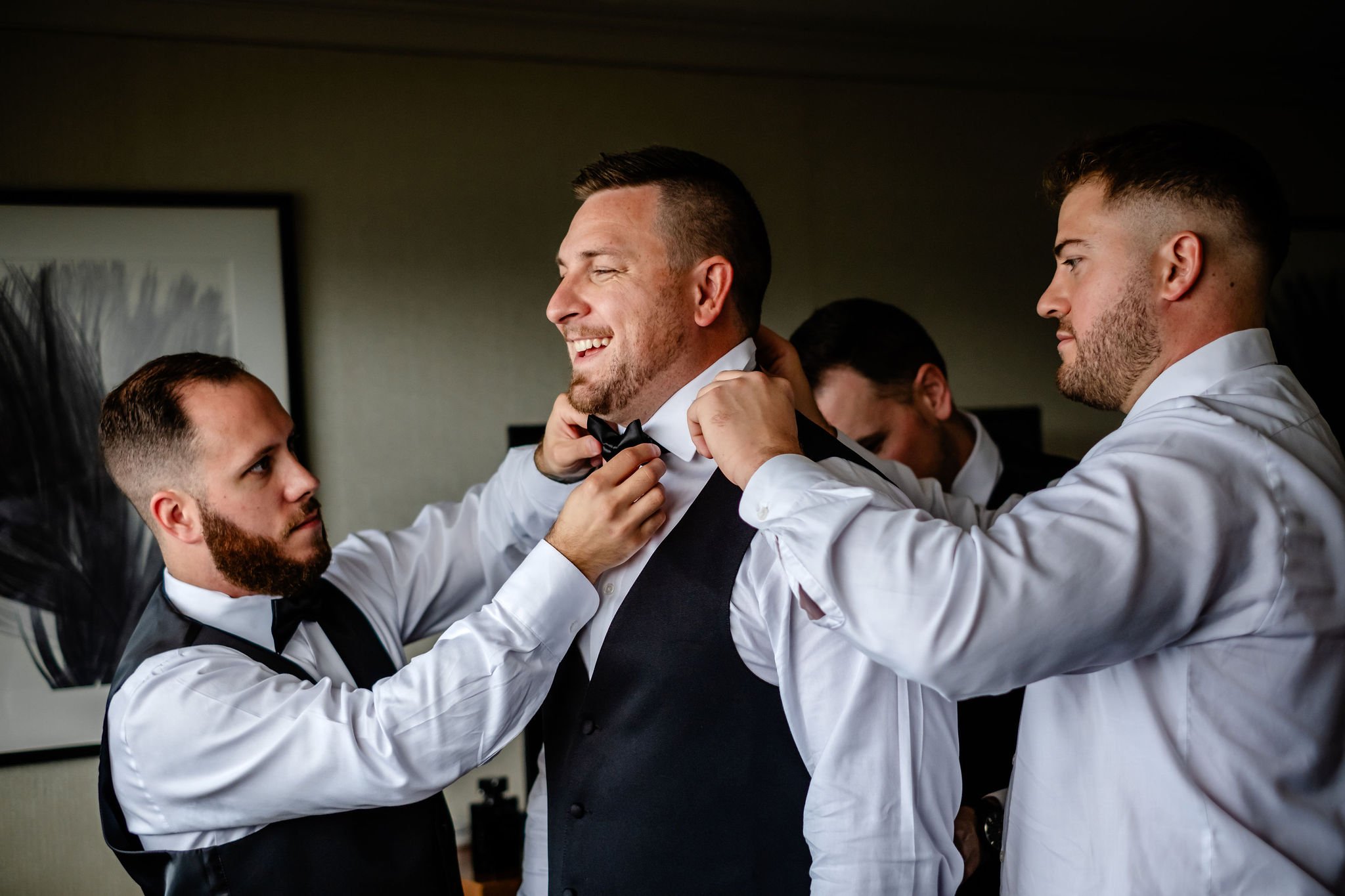 photos of a groom getting ready for his wedding at the Westin hotel