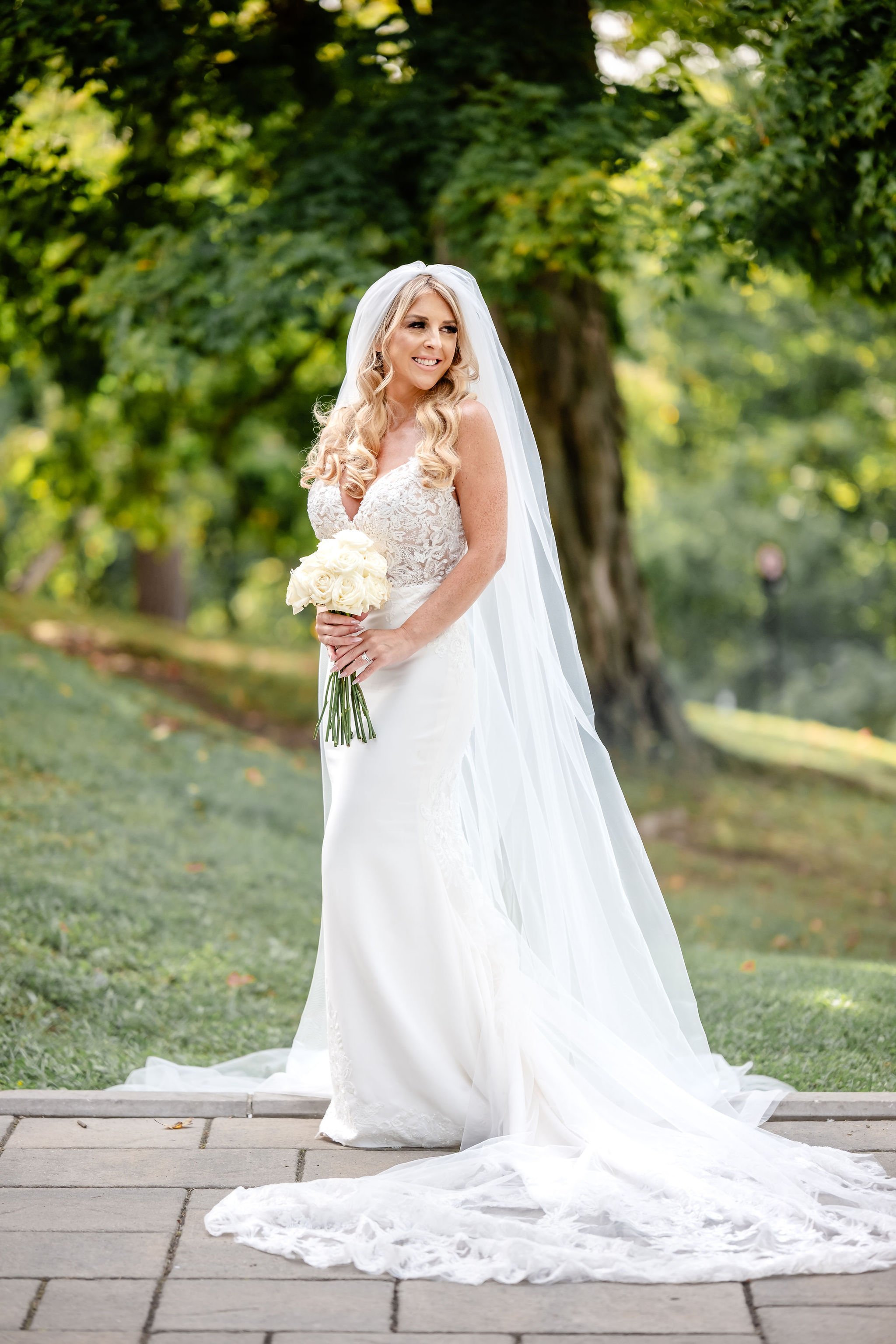 photograph of a bride in her wedding dress at rockcliffe park in ottawa