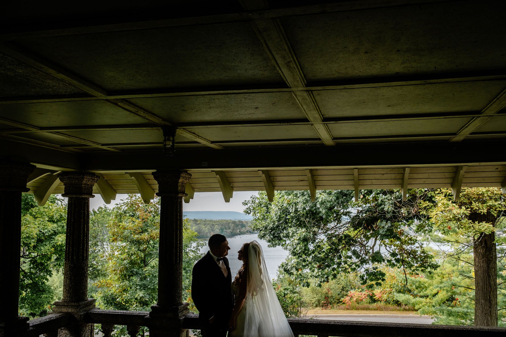 a bride and groom on their wedding day in rockliffe park in ottawa