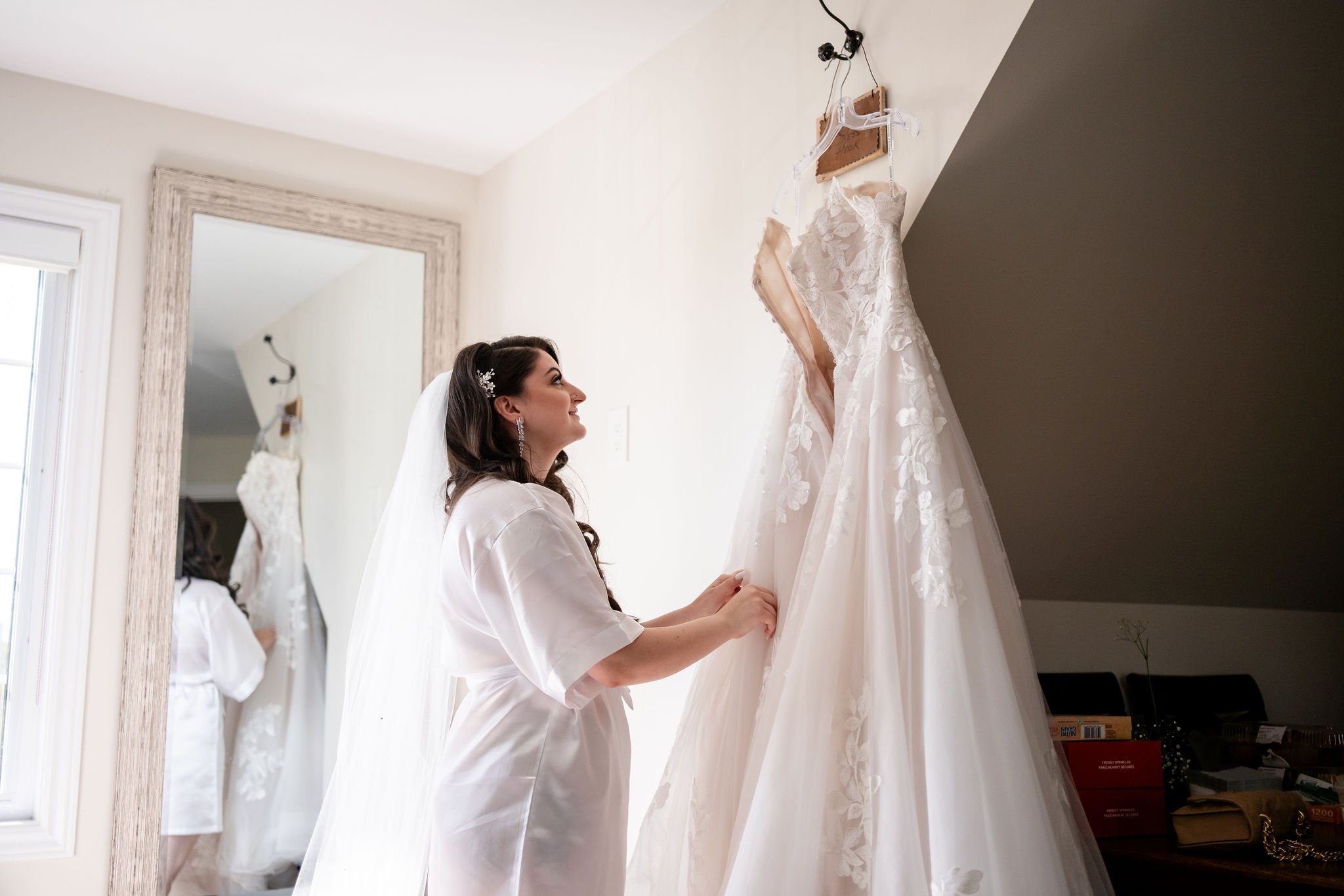 a bride looking at her wedding dress