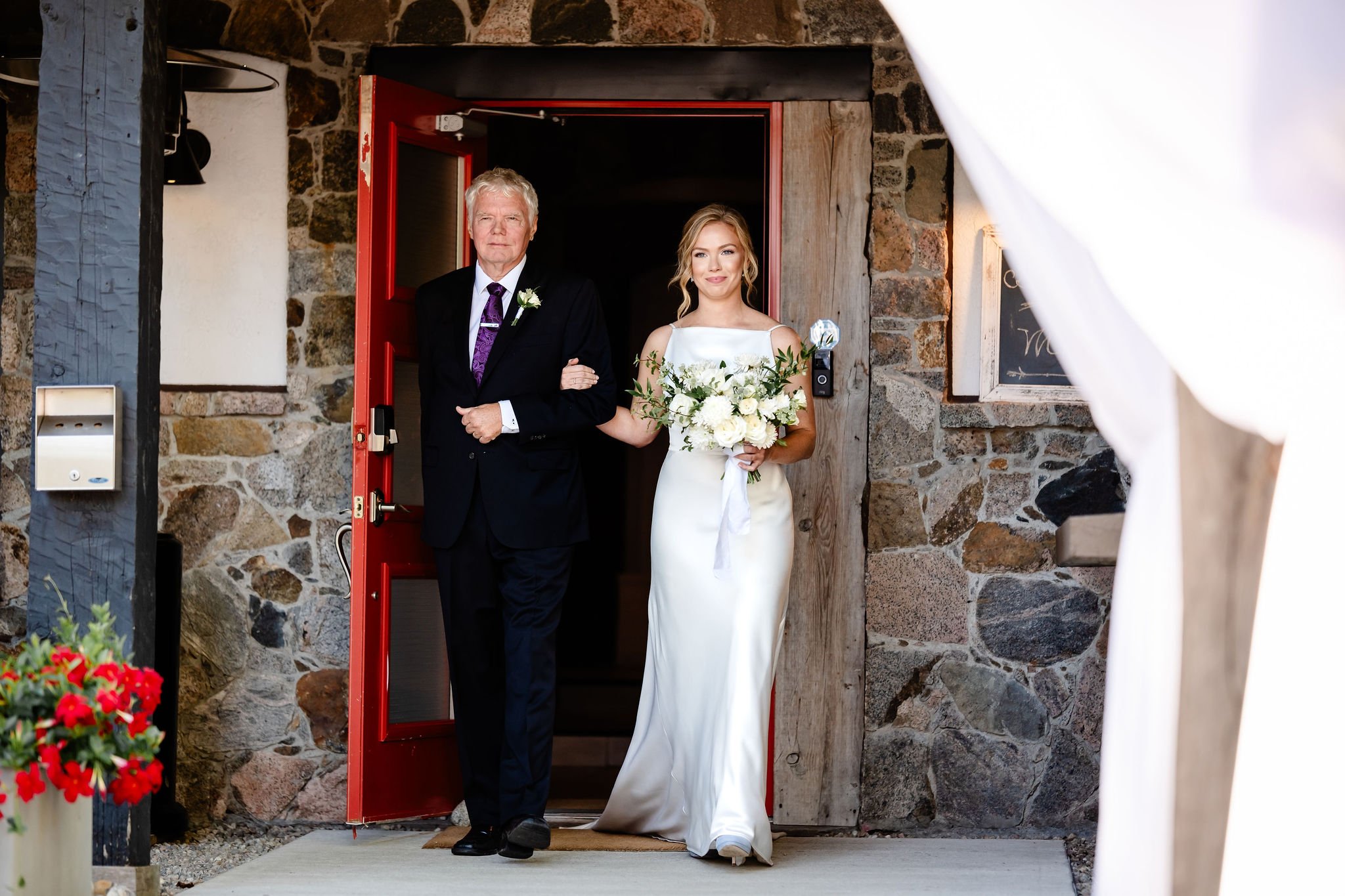 a bride and her father walking down the aisle