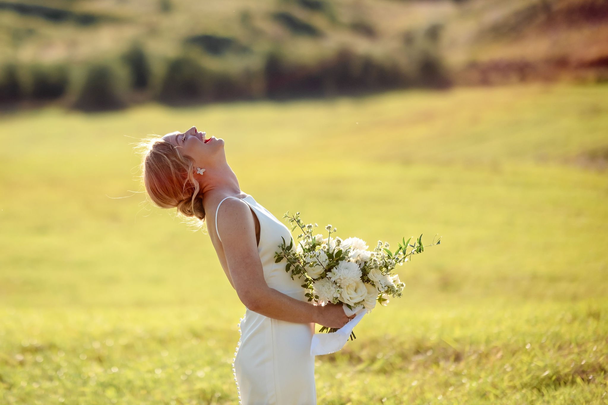 great candid photo of a bride laughing