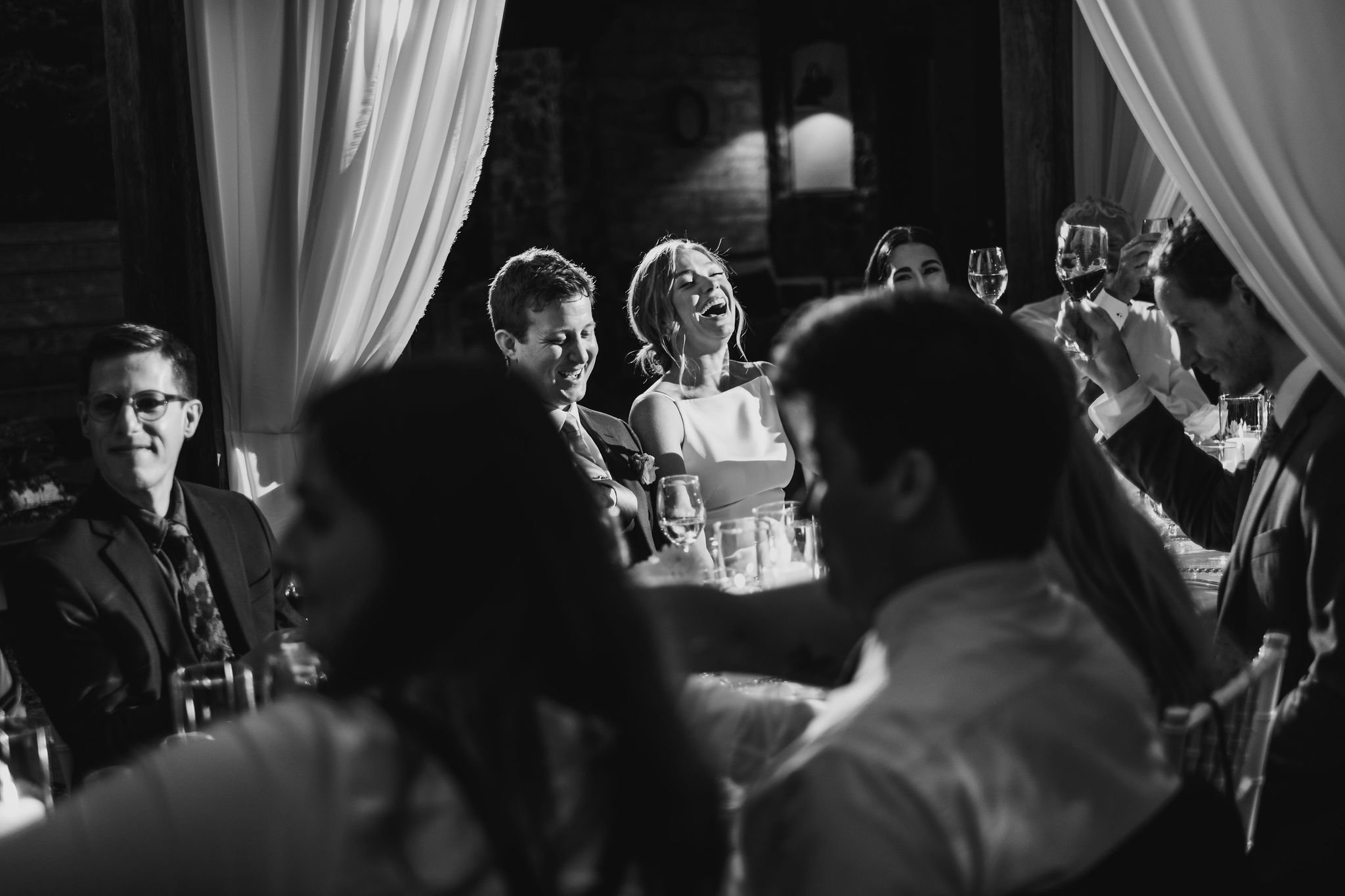 candid black and white photo at a wedding reception