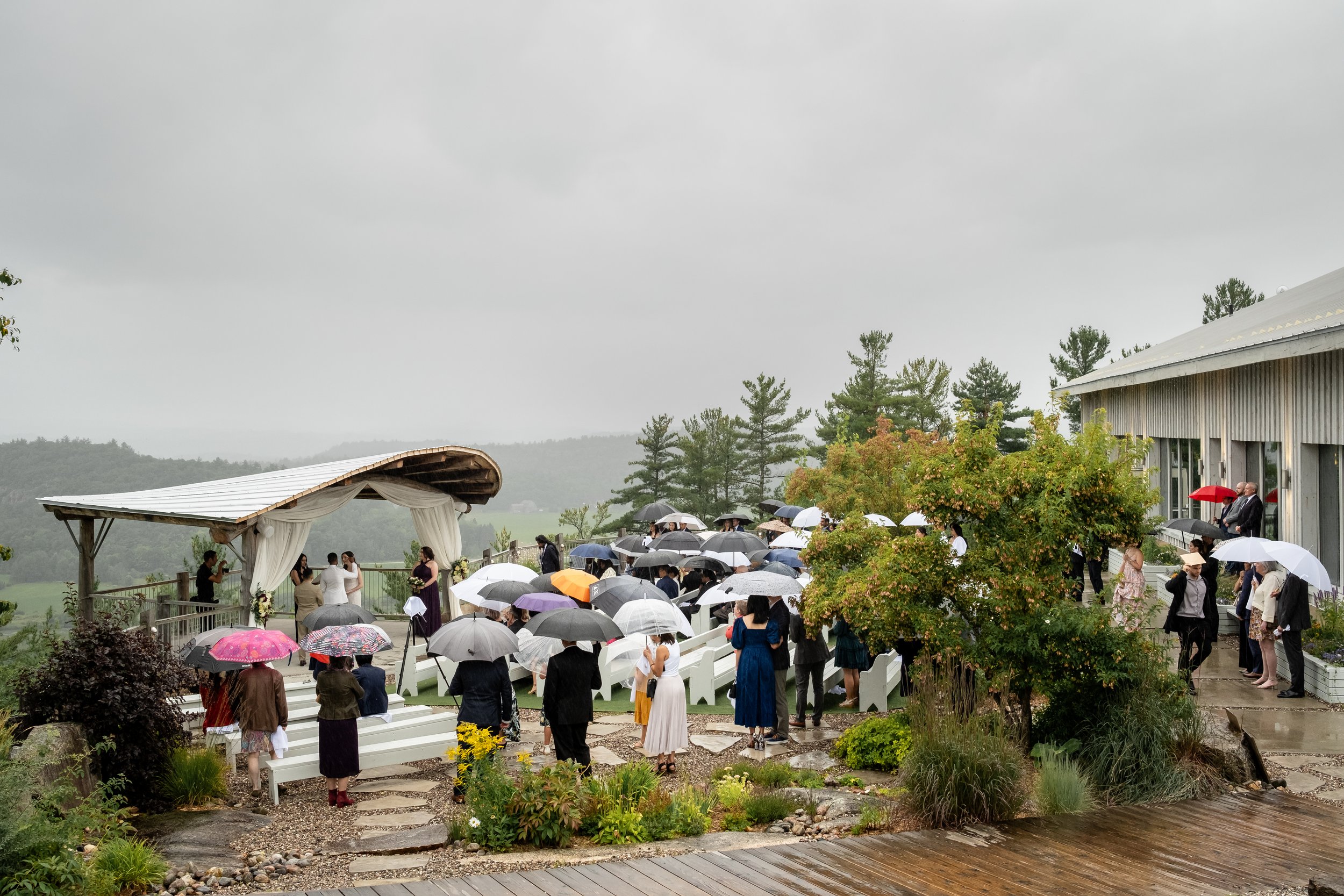 photograph from a rainy ceremony at a le belvedere wedding