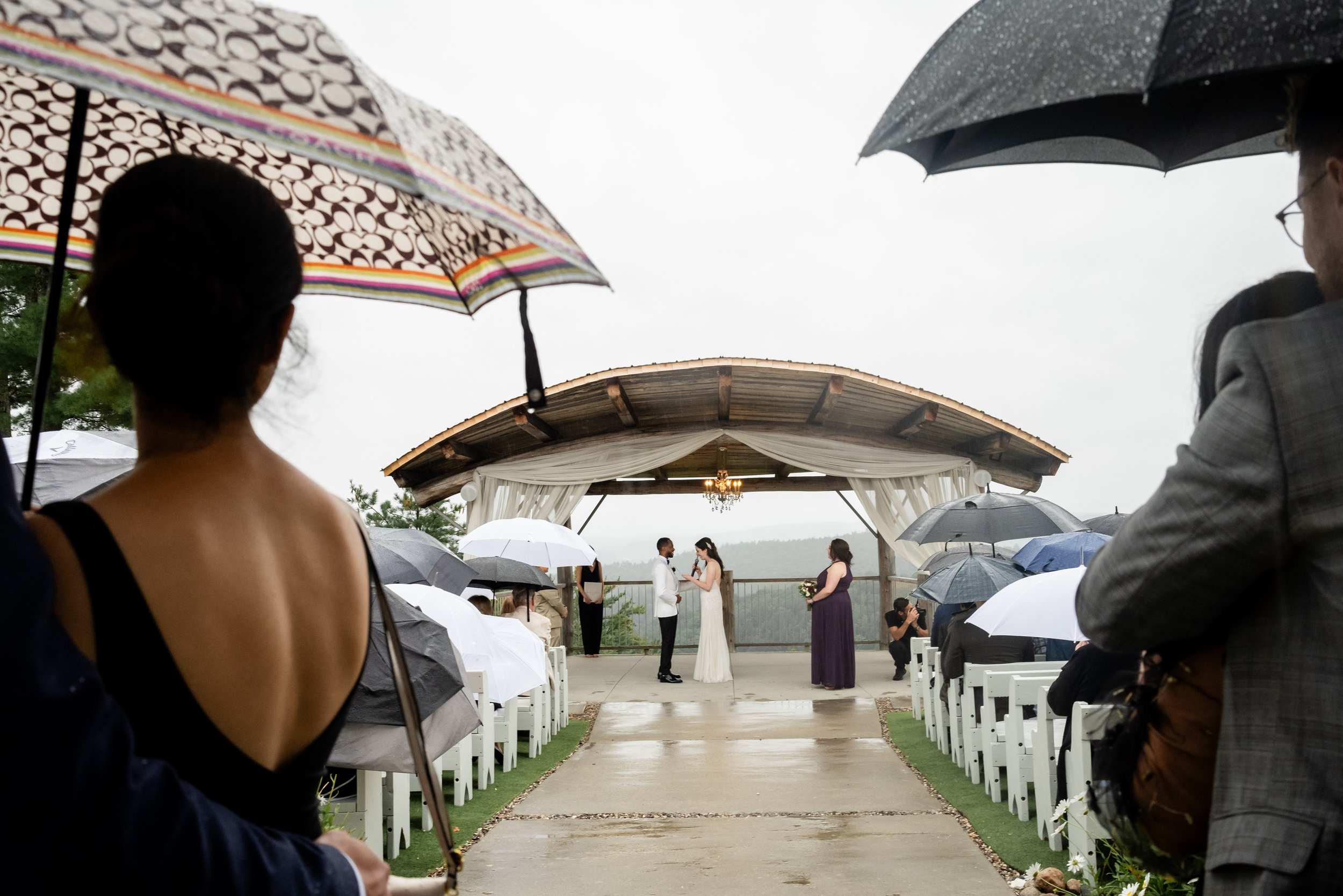 photograph from a rainy ceremony at a le belvedere wedding