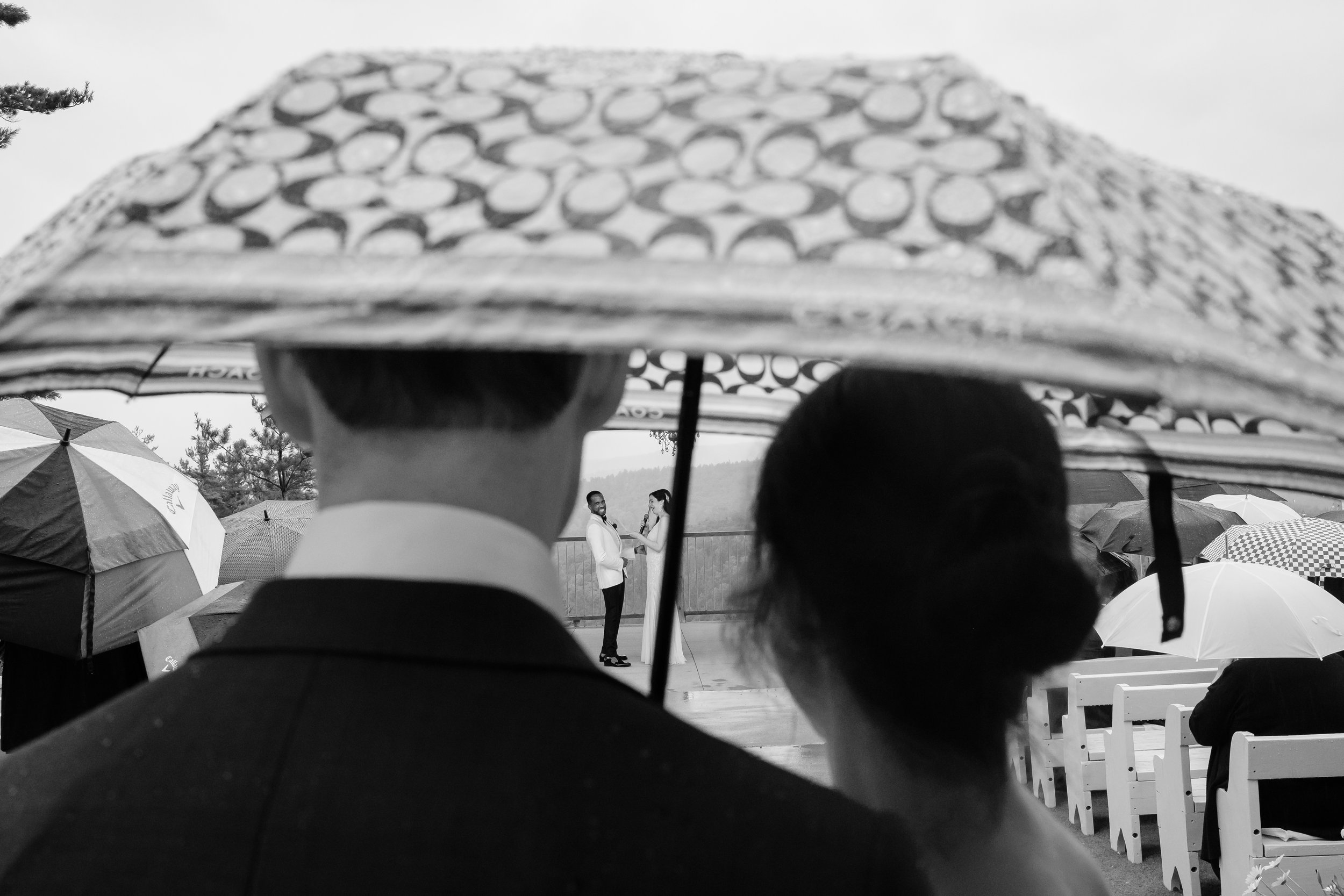 photograph from a rainy ceremony at a le belvedere wedding