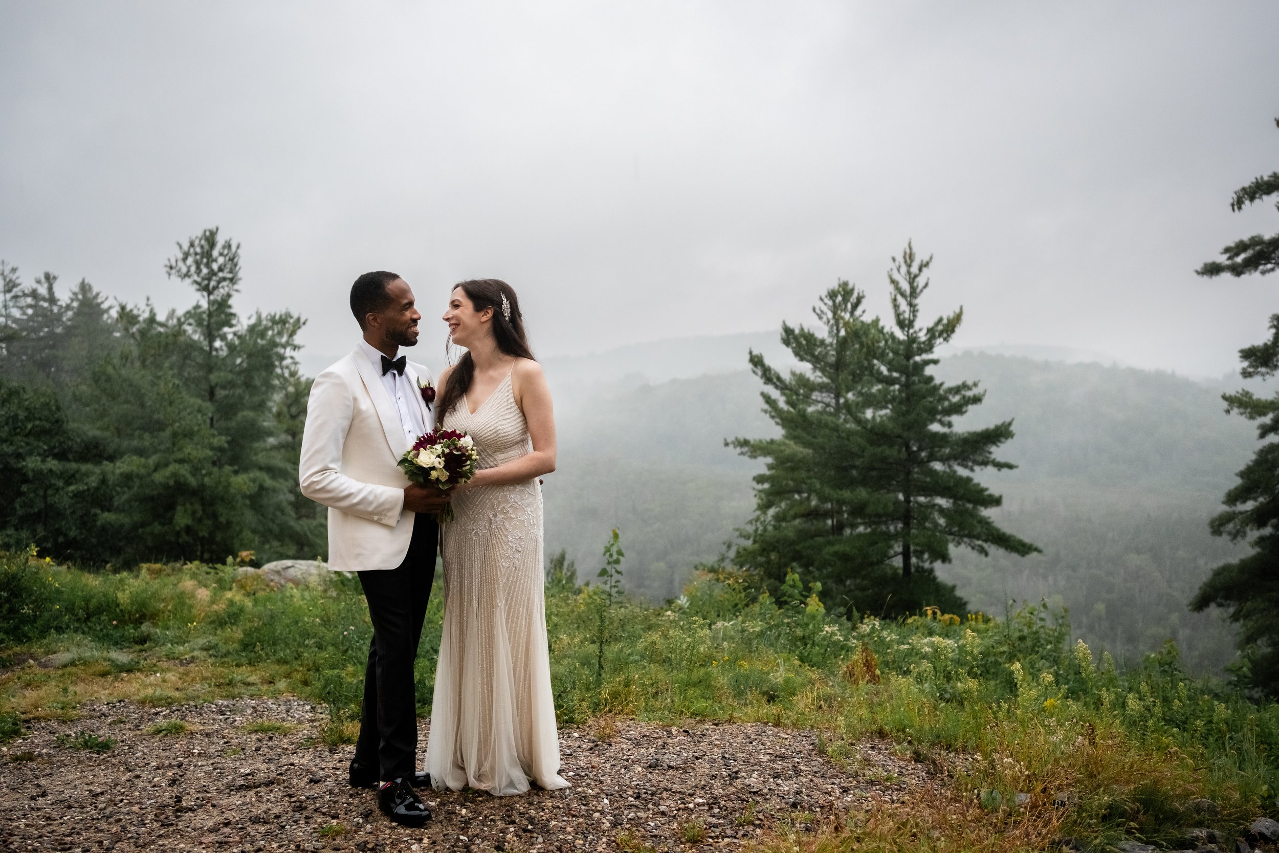 out door couple's portraits on a foggy and raining day at a le belvedere wedding