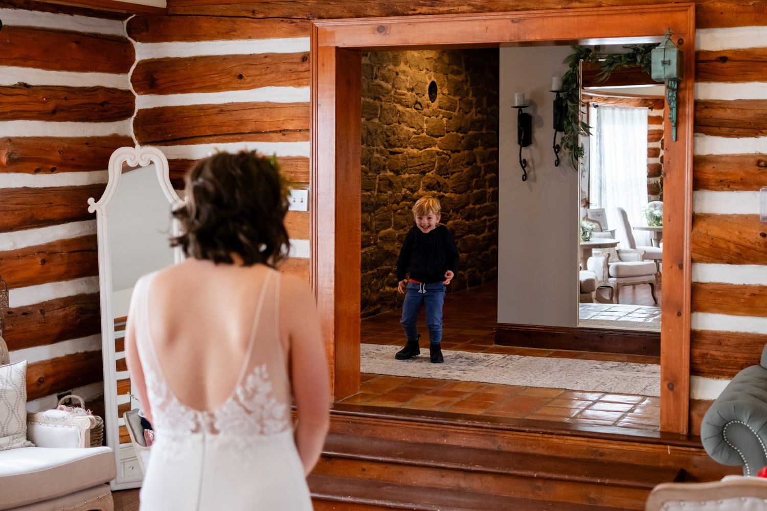 a little boy seeing a bride in her wedding dress