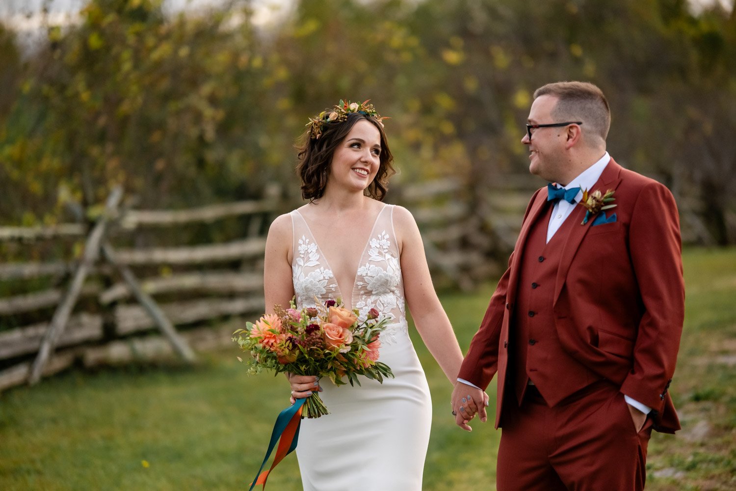 bride and groom walking hand in hand 