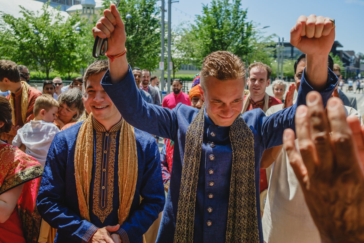 groom dancing on his way to his wedding ceremony