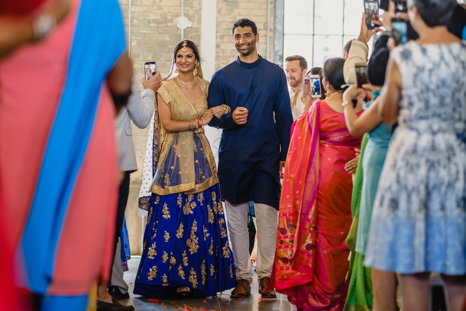 indian bride walking down the aisle