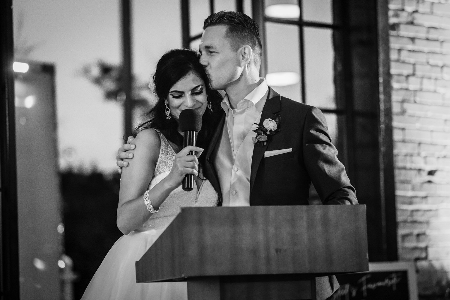 black and white photo of a couple giving their wedding speech