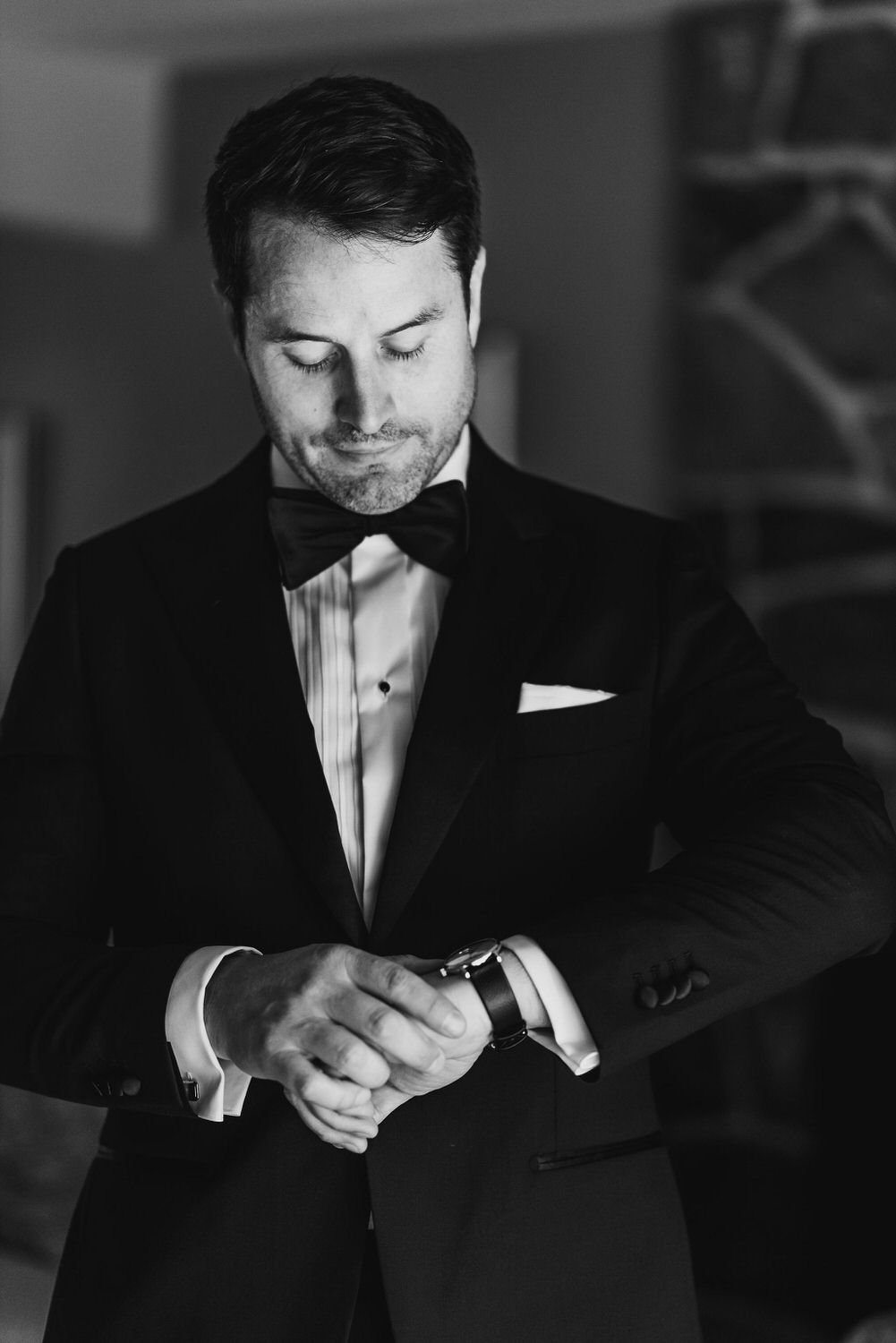 black and white wedding photograph of a groom