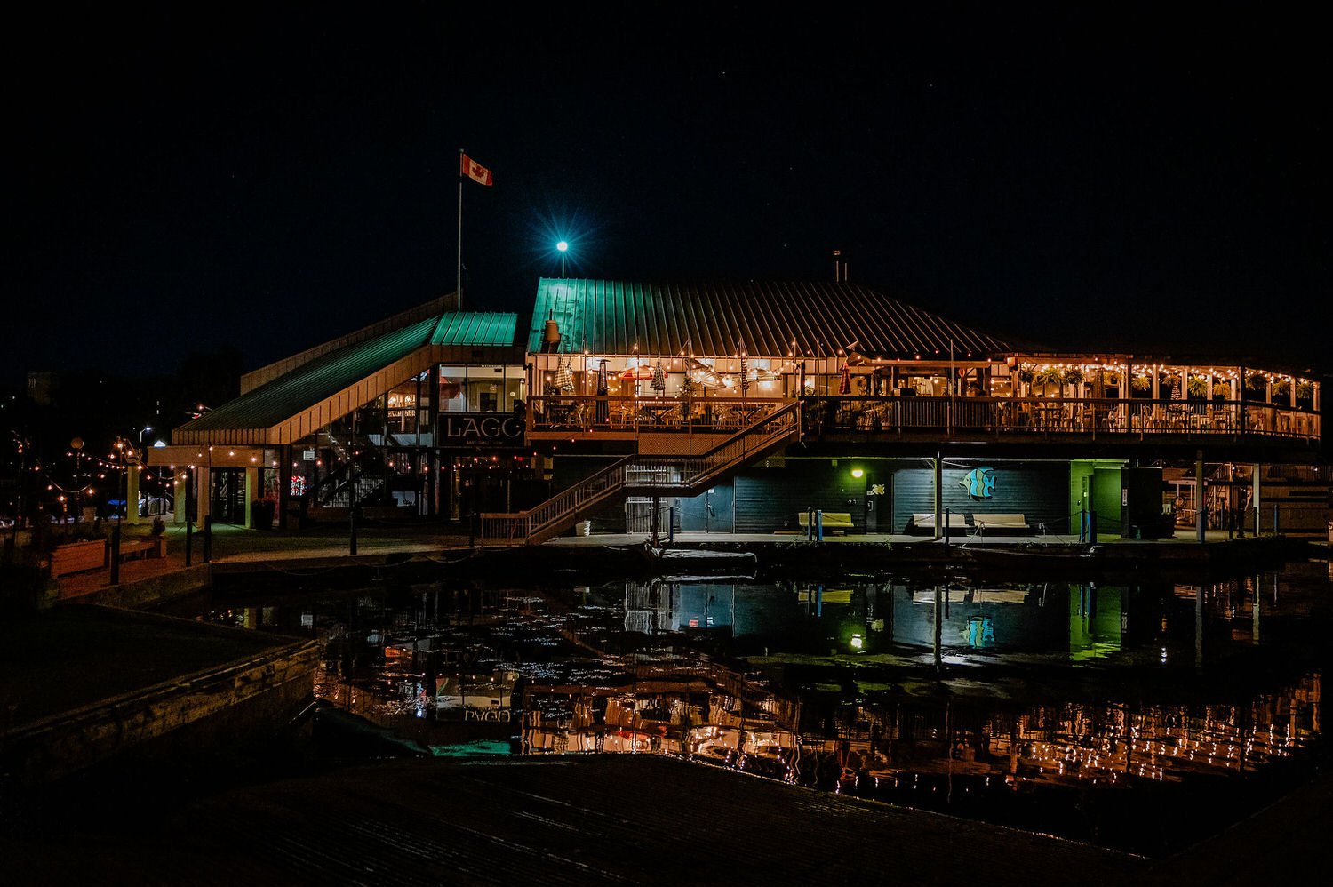 photograph of the exterior or Lago restaurant at night