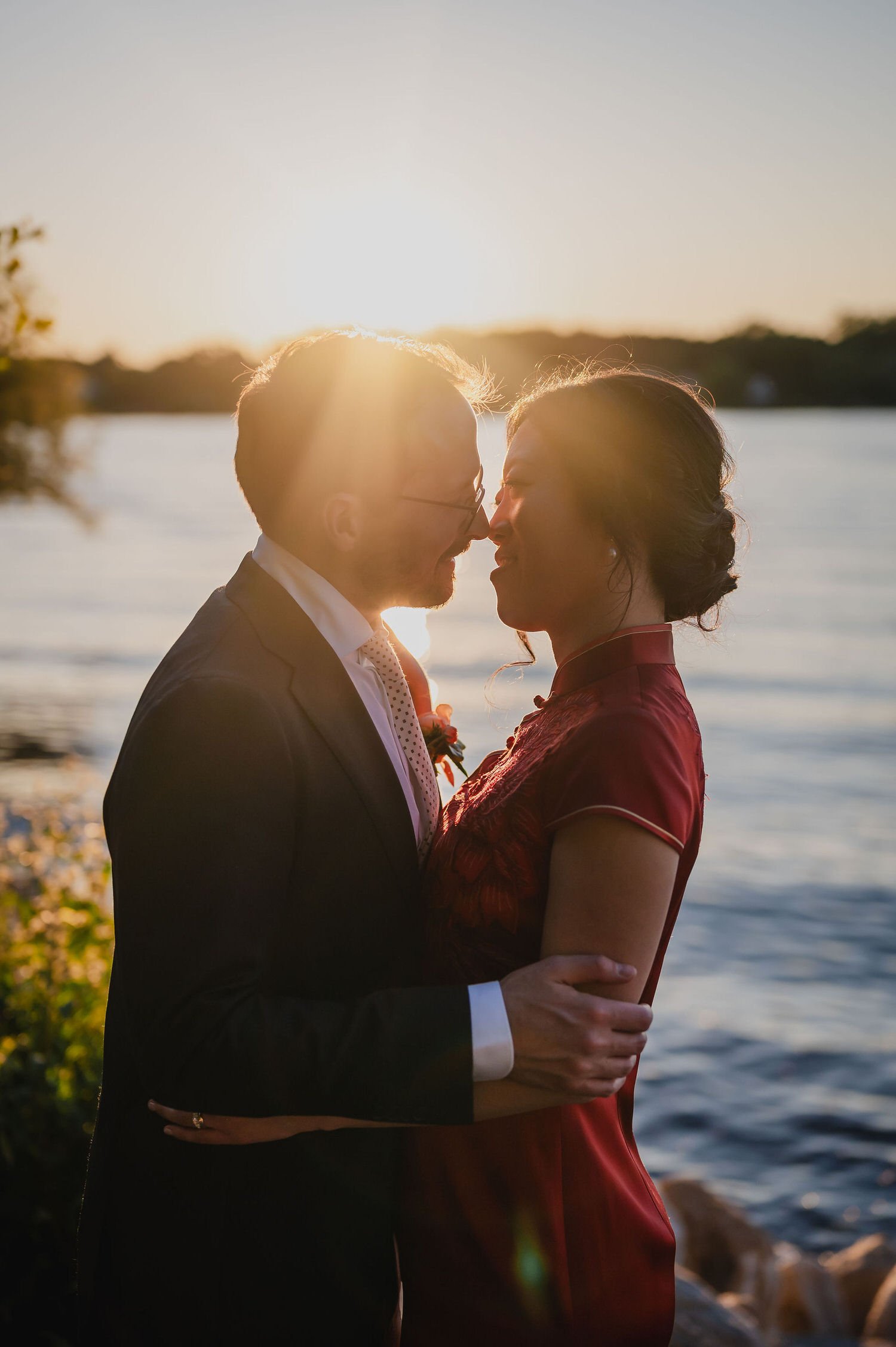 a bride and groom portrait outside the wedding photographs outside the NCC River House at sunset in Ottawa