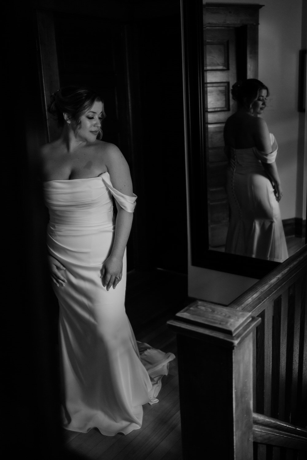 a photo of a bride getting into her wedding dress