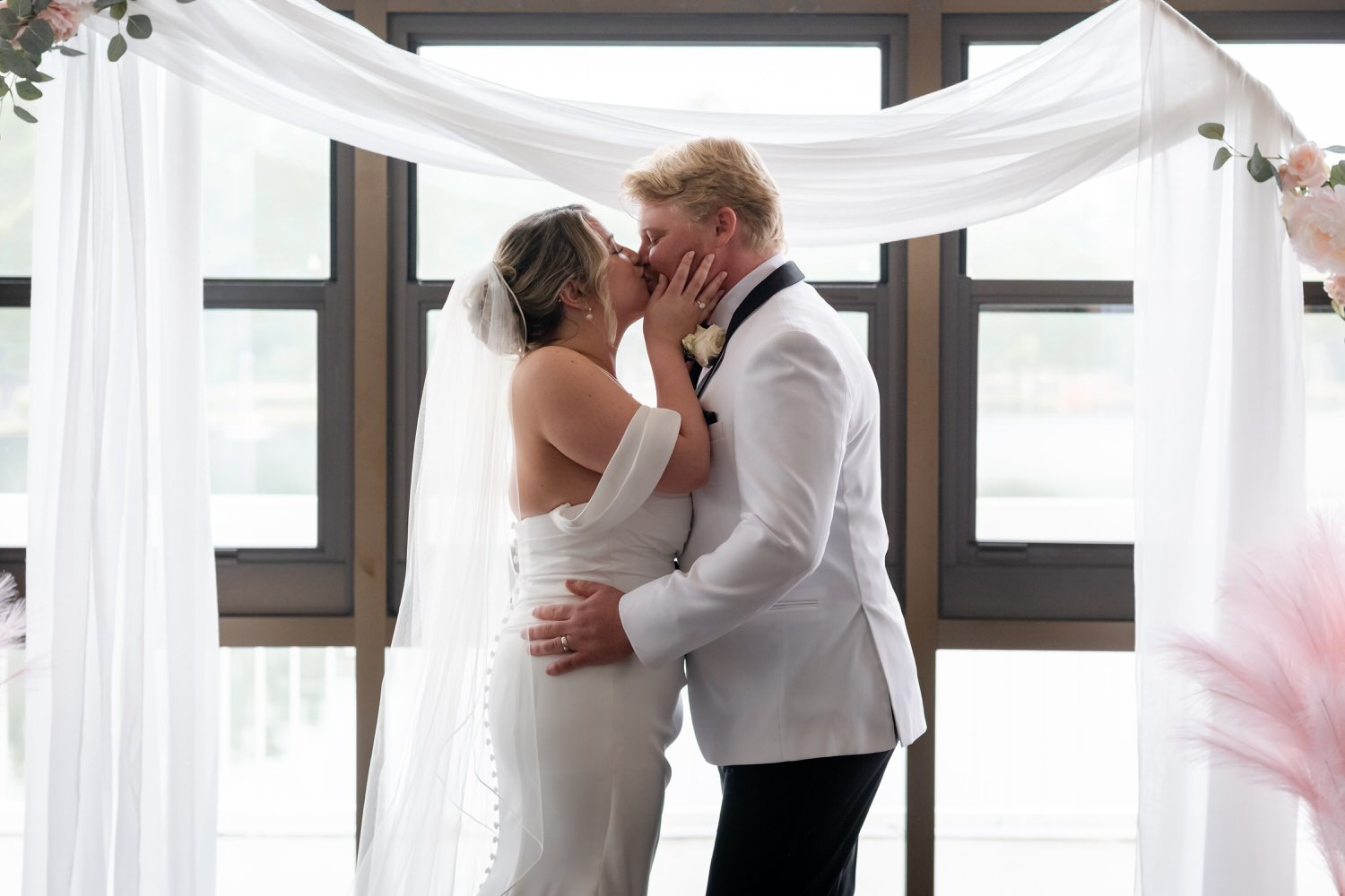 first kiss at a Wedding ceremony at Lago in ottawa in the vista room